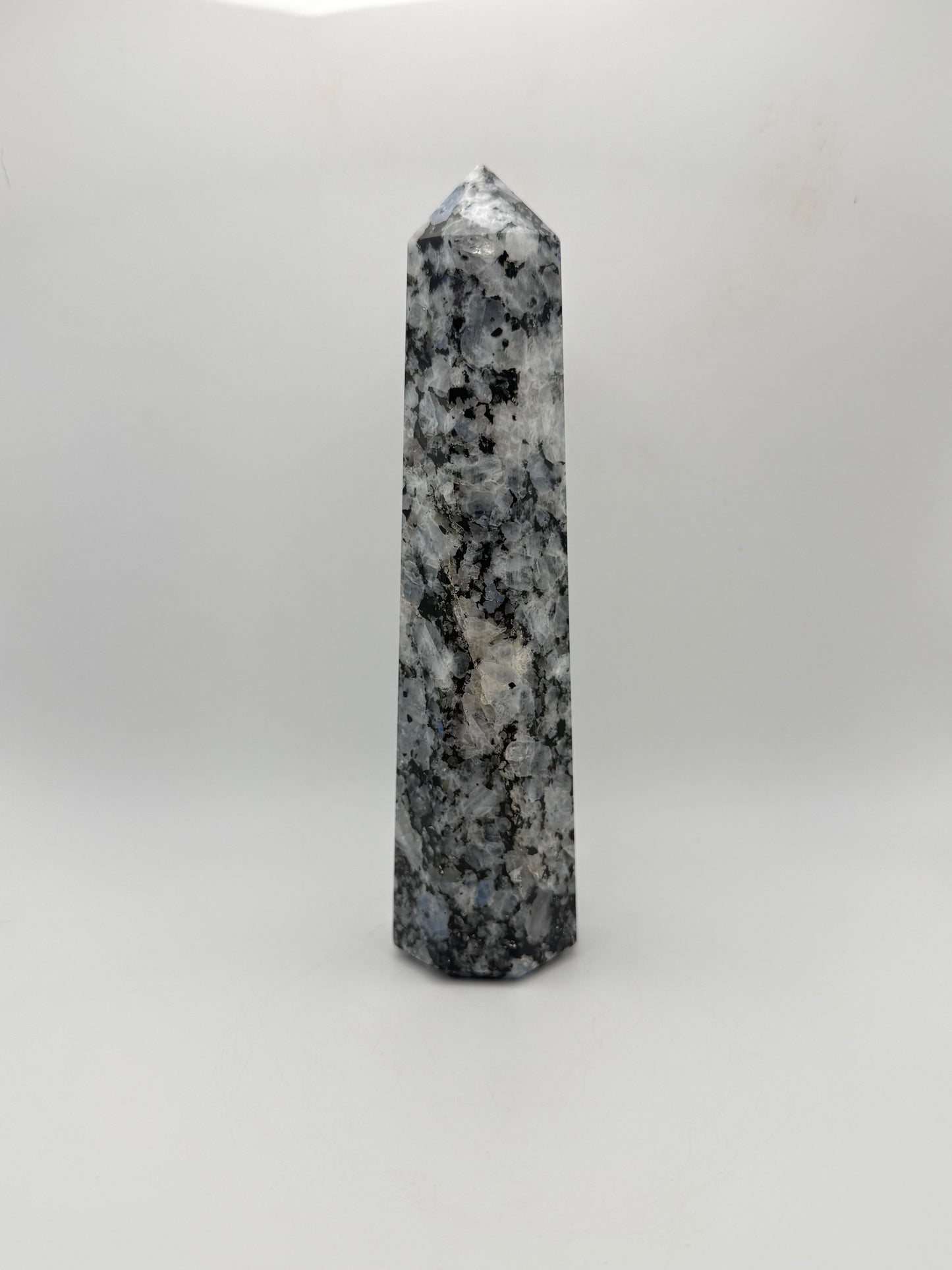 Rainbow moonstone polished tower with nice flashes of blue.