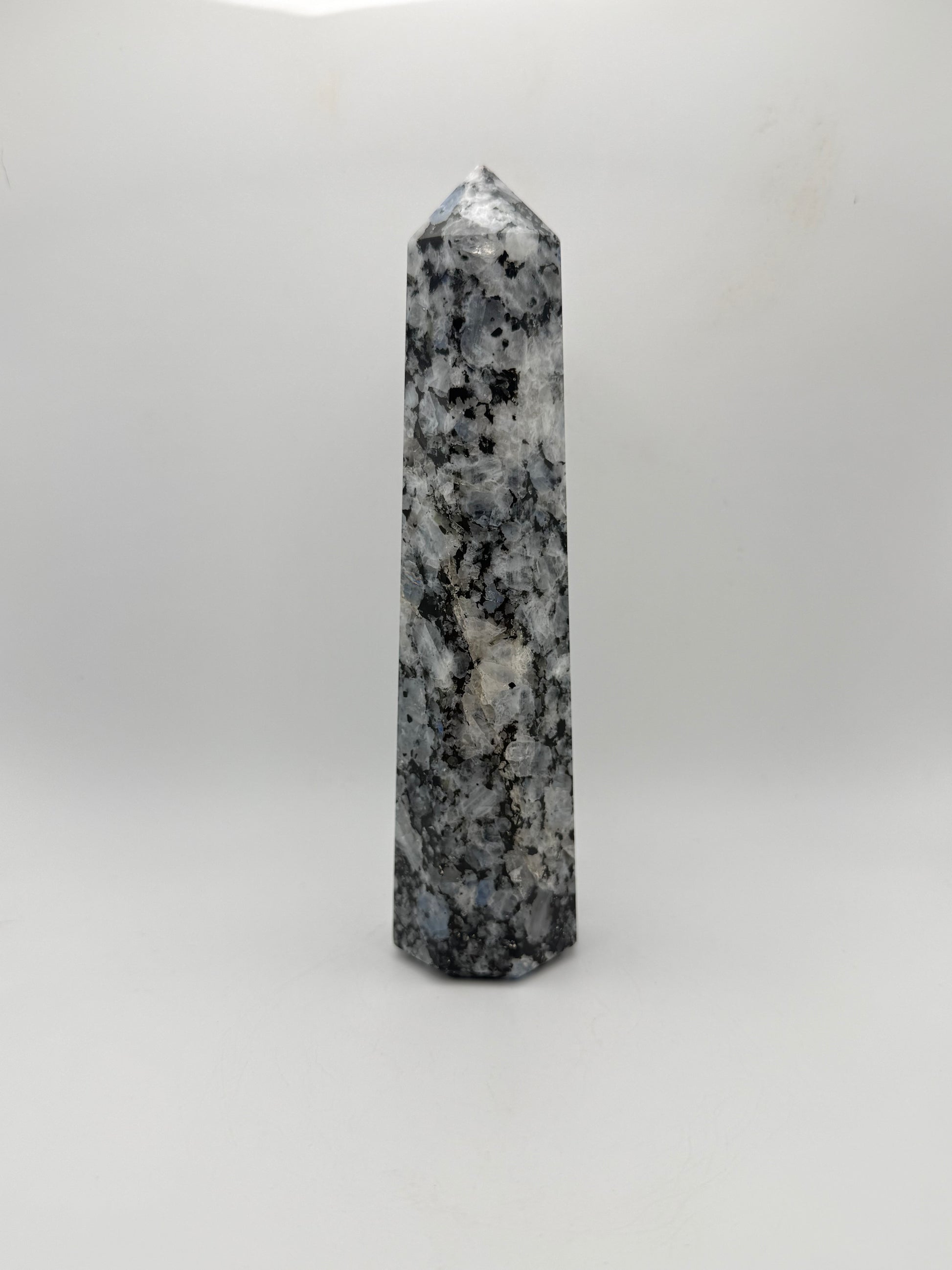 Rainbow moonstone polished tower with nice flashes of blue.