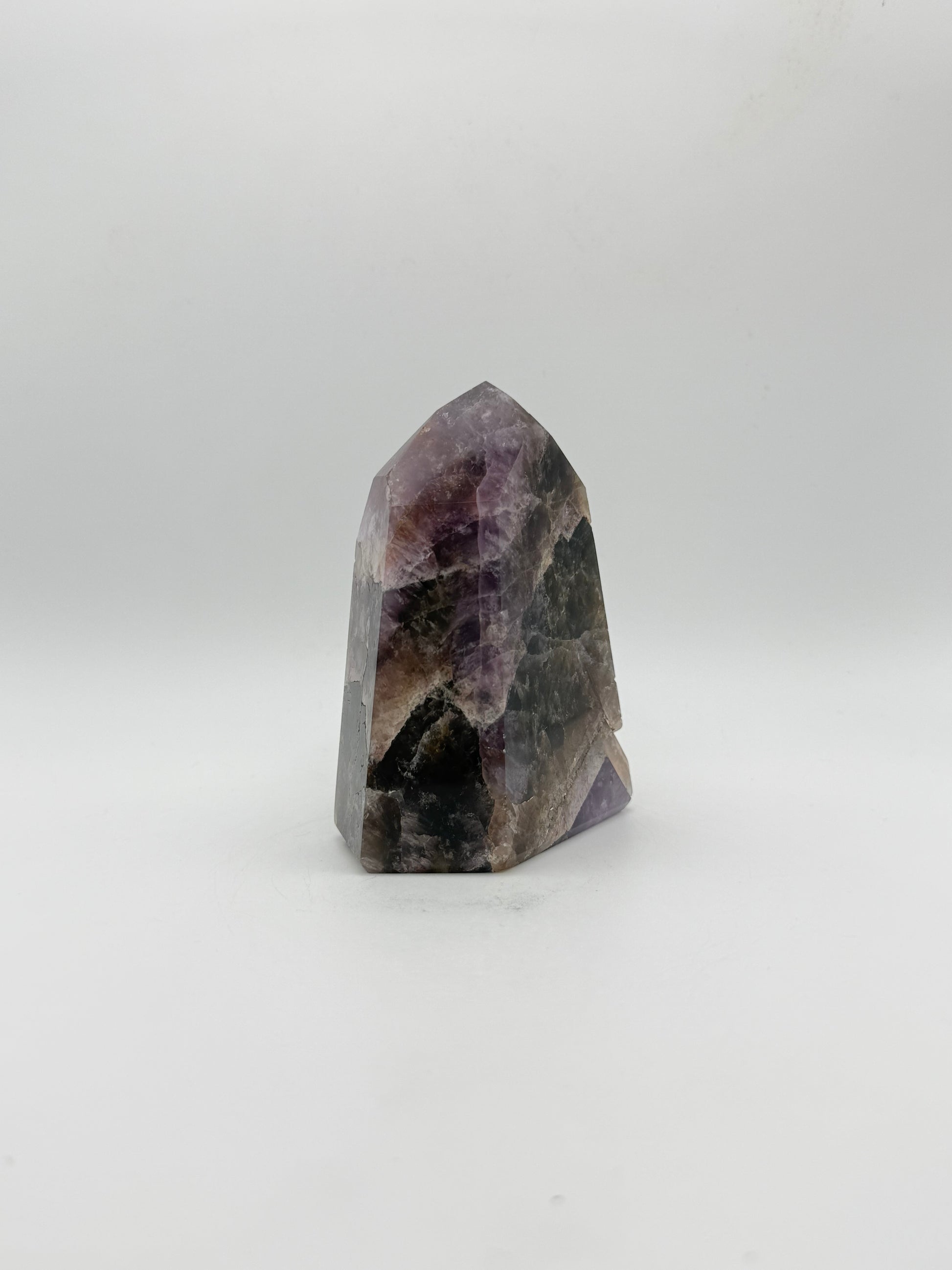 Polished super 7 in the shape of a tower.