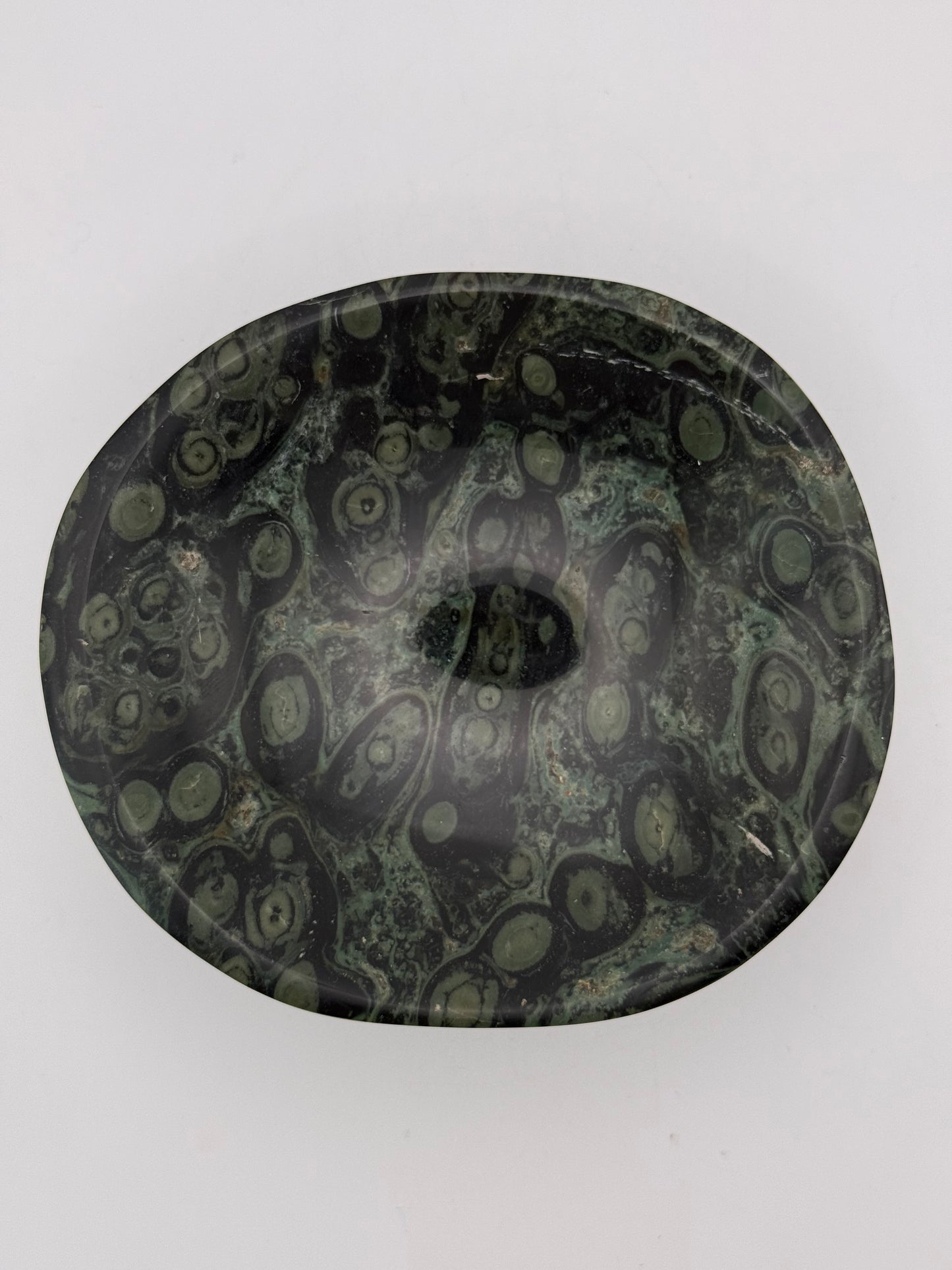 Polished kambaba jasper in the shape of a bowl.