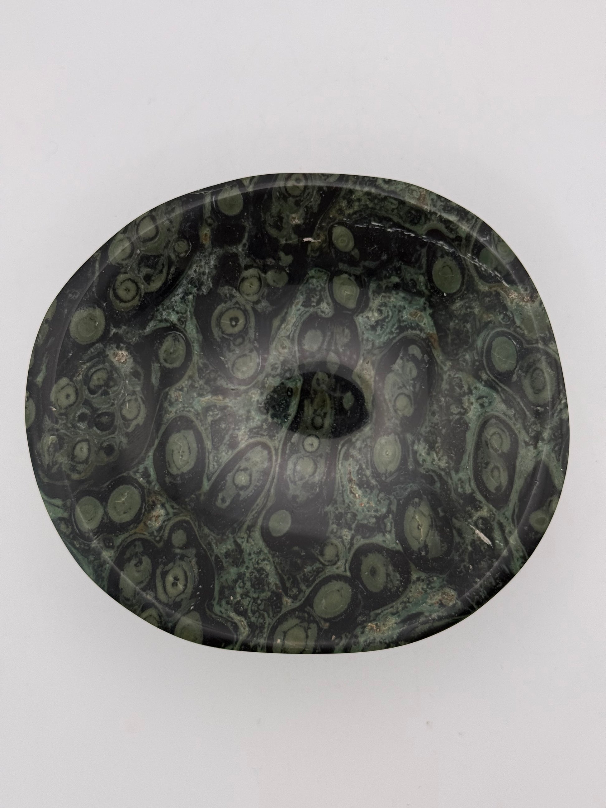 Polished kambaba jasper in the shape of a bowl.