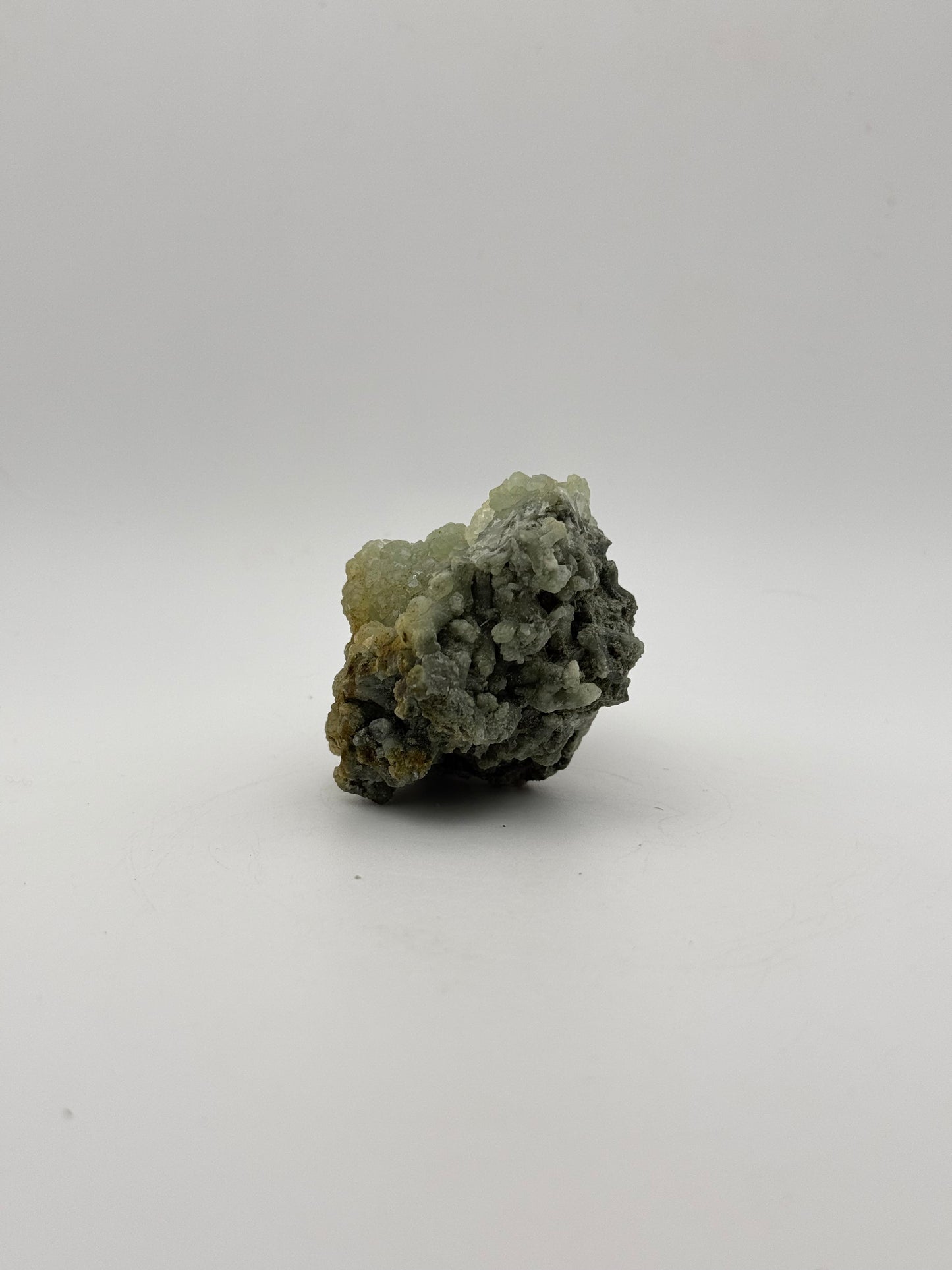 Raw Prehnite specimen with amazing green color.