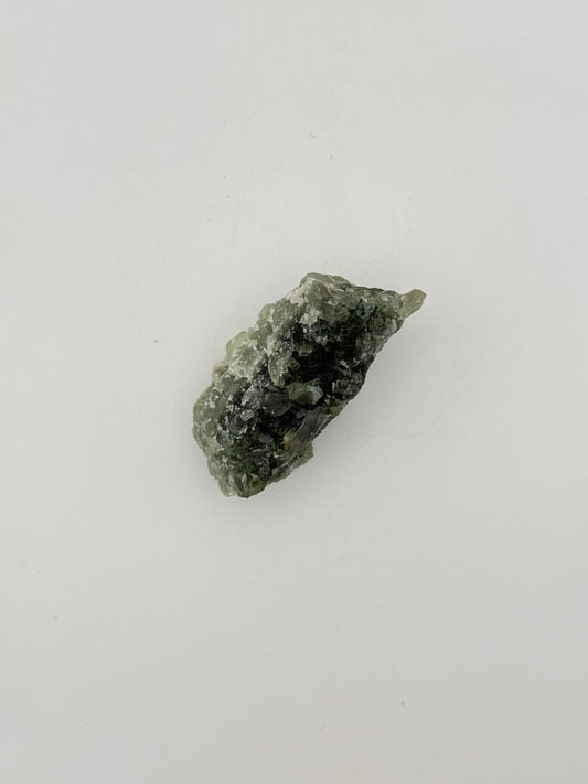 Raw Prehnite specimen with amazing green color.