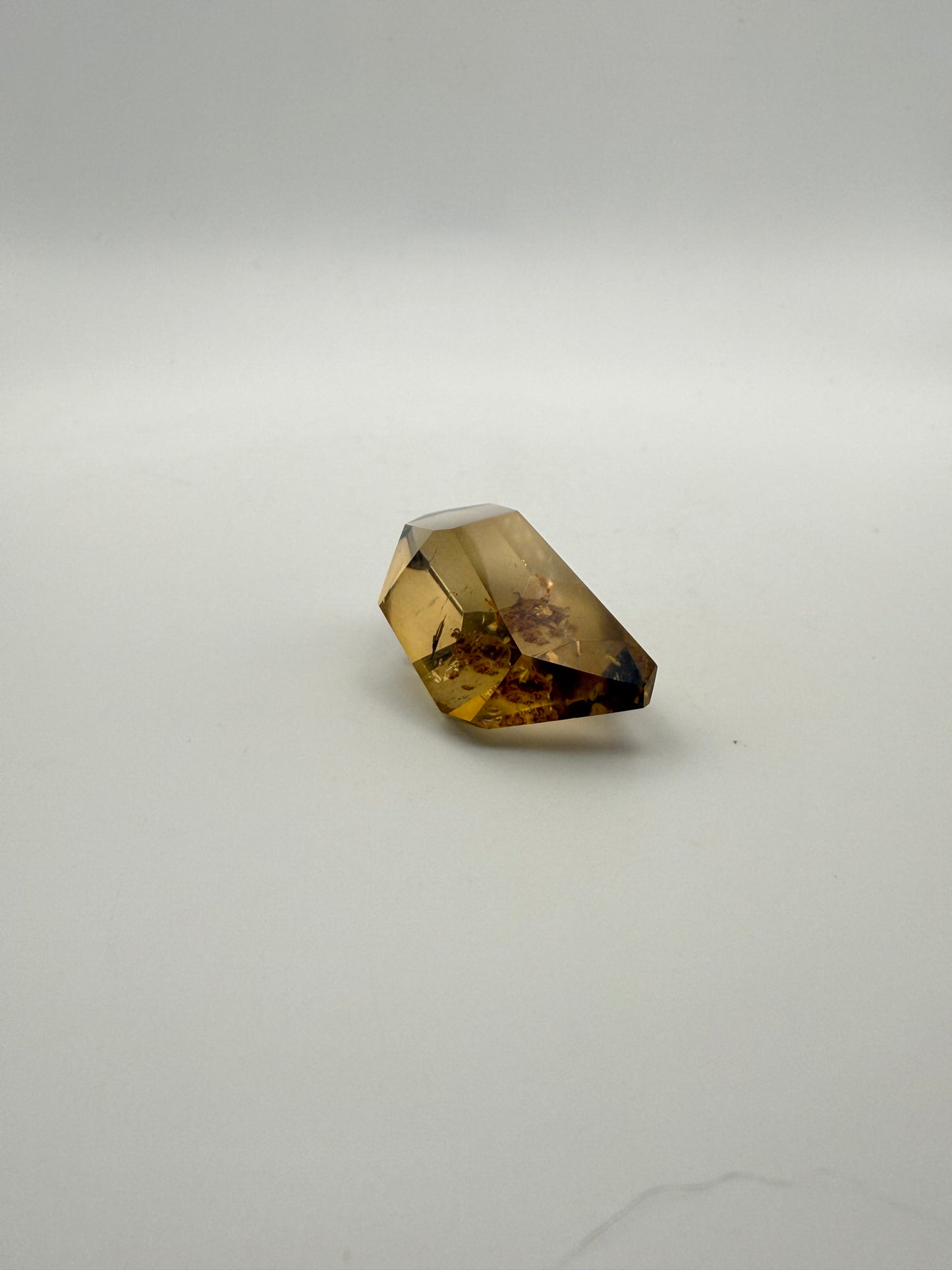 Polished natural citrine point.