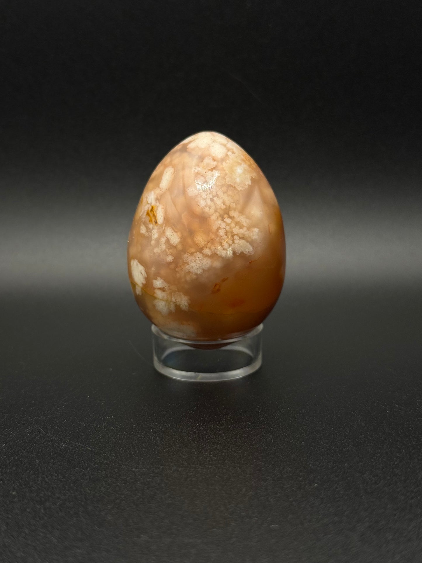 Flower Agate polished crystal in the shape of an egg.