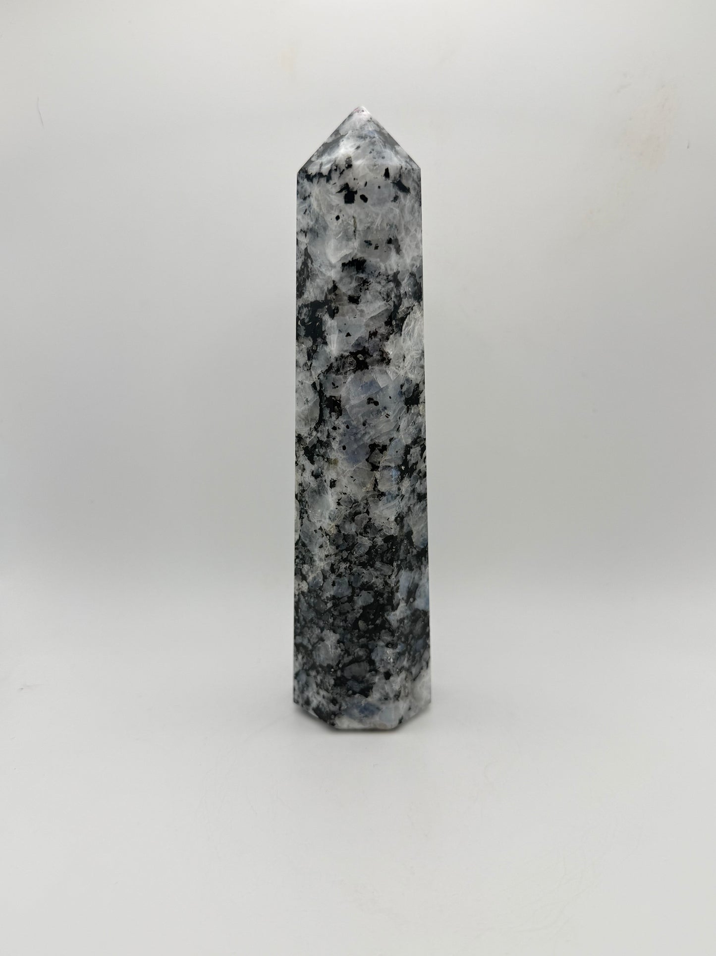 Rainbow moonstone polished tower with nice flashes of blue.