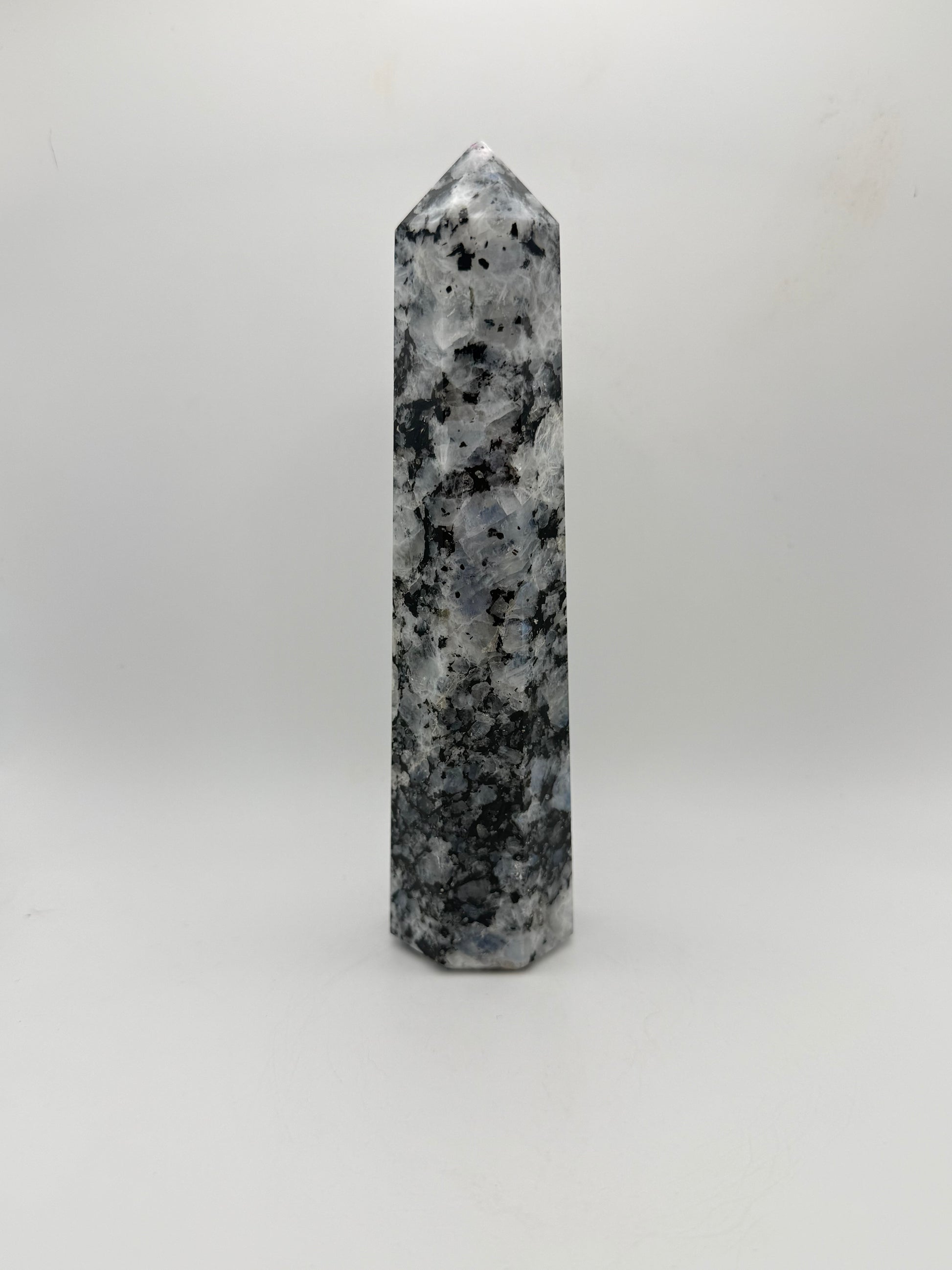 Rainbow moonstone polished tower with nice flashes of blue.