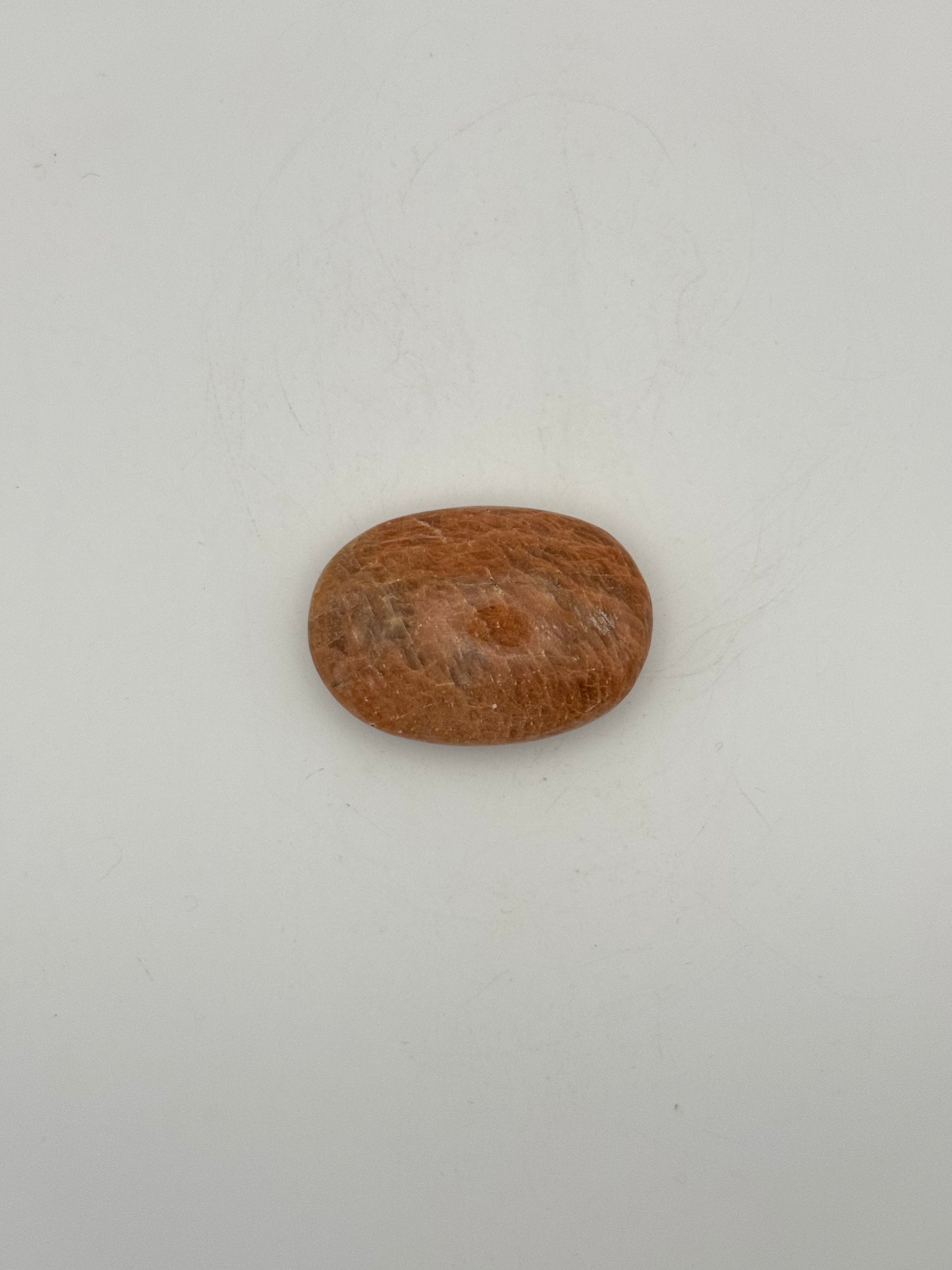 Polished Peach moonstone palm stone.
