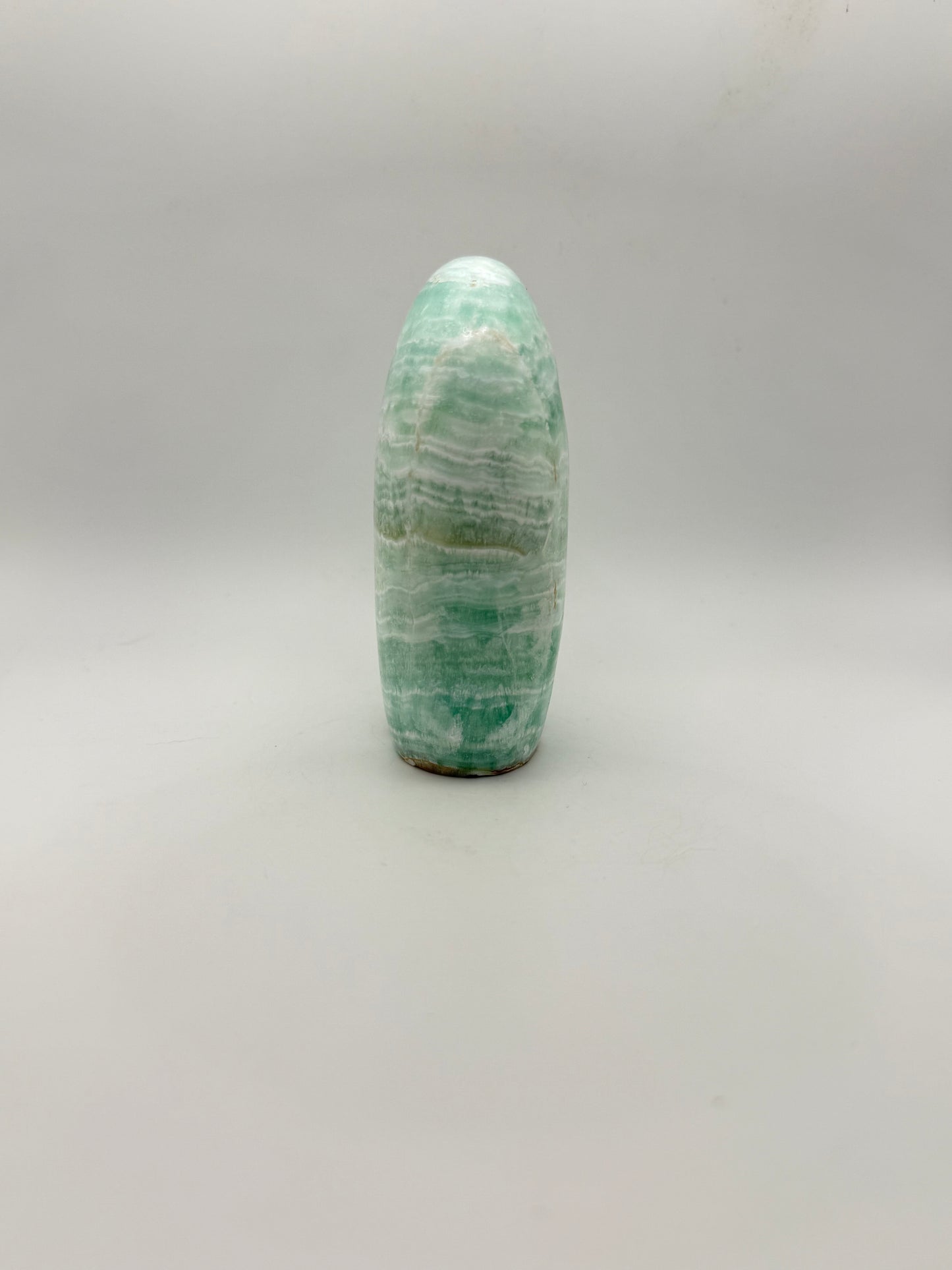 Caribbean calcite polished crystal free form in the shape of a dome.