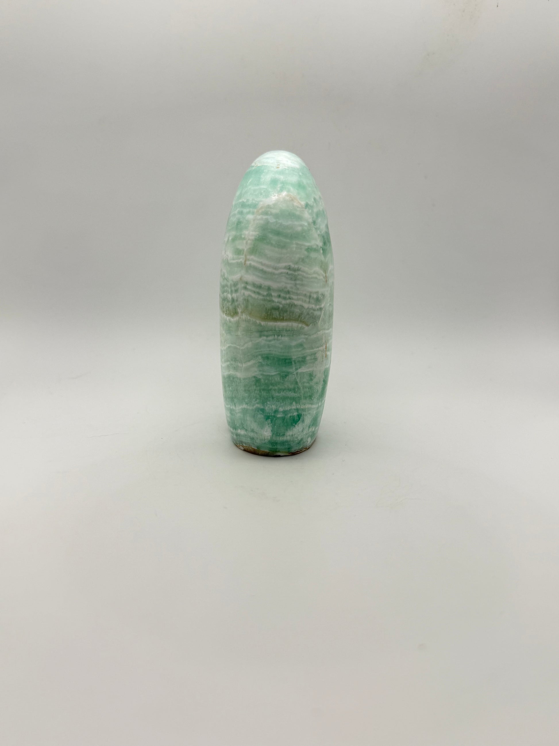 Caribbean calcite polished crystal free form in the shape of a dome.