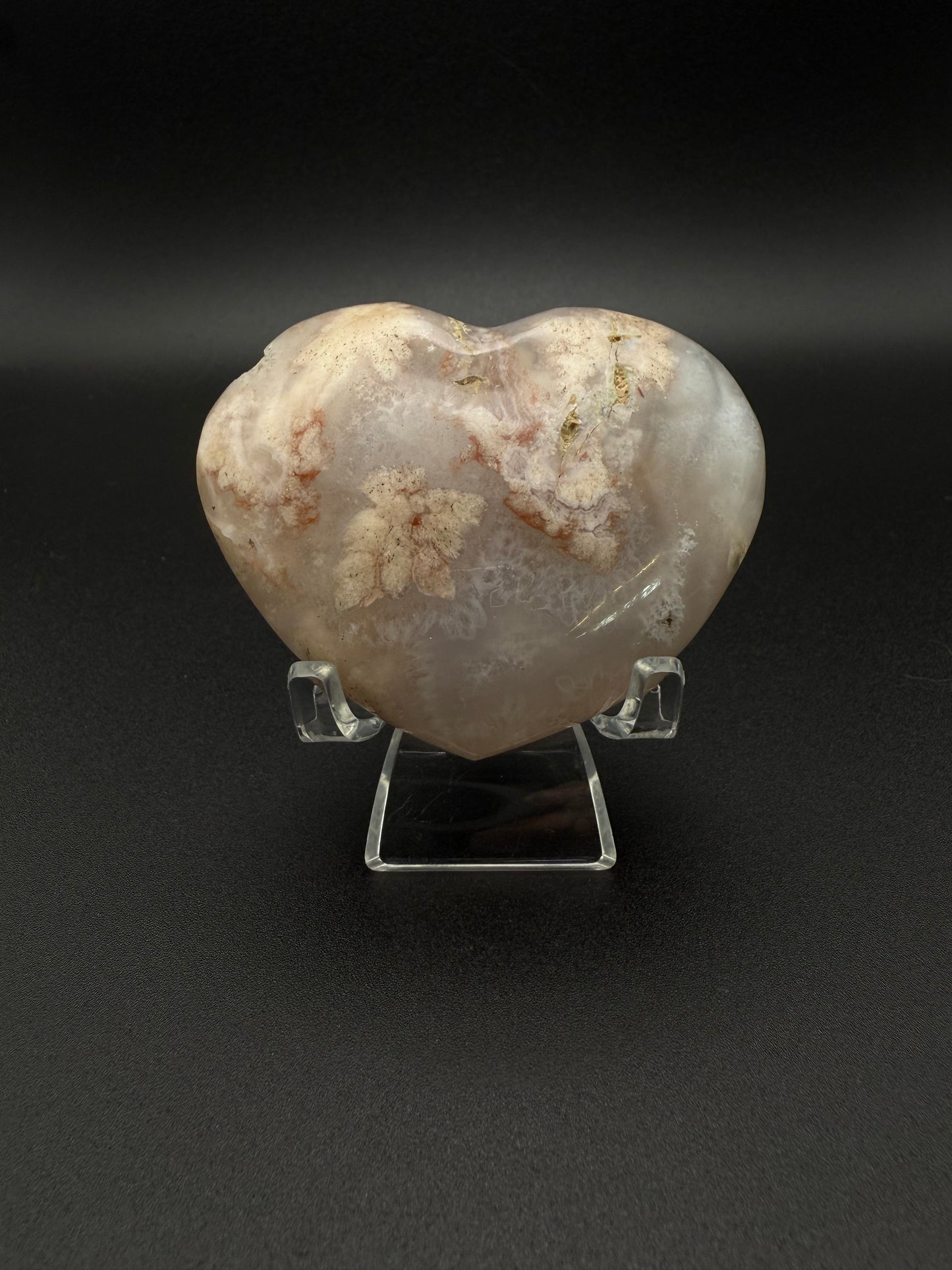 Heart-shaped polished flower agate crystal.