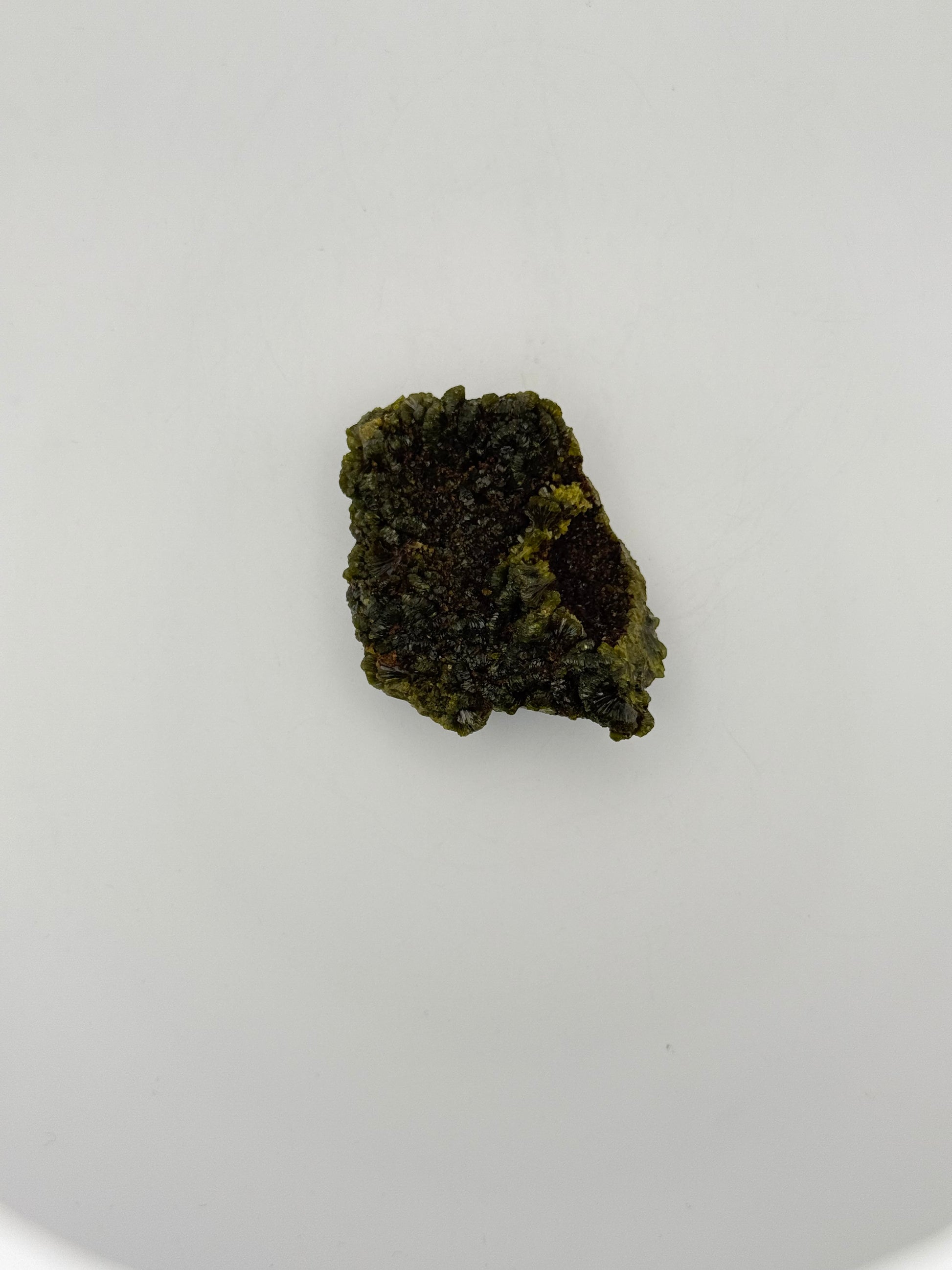 Epidote crystal cluster with good green color.