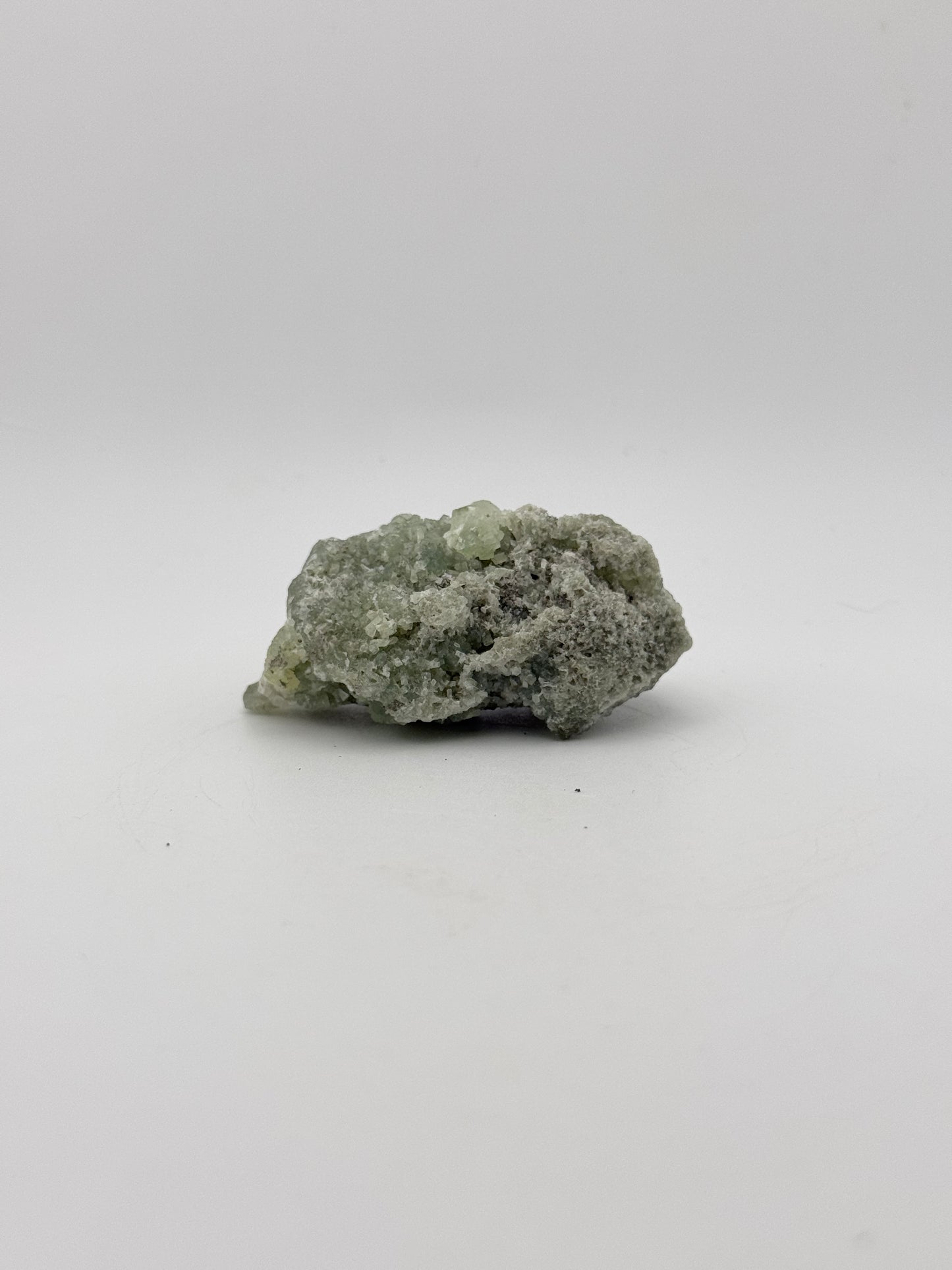 Raw Prehnite specimen with amazing green color.