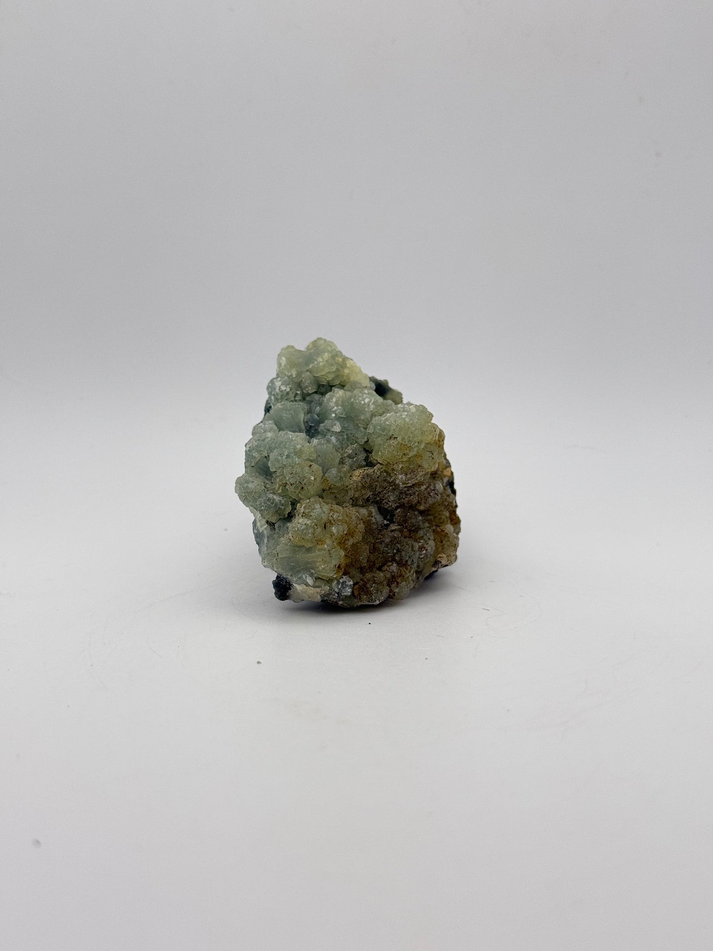 Raw Prehnite specimen with amazing green color.