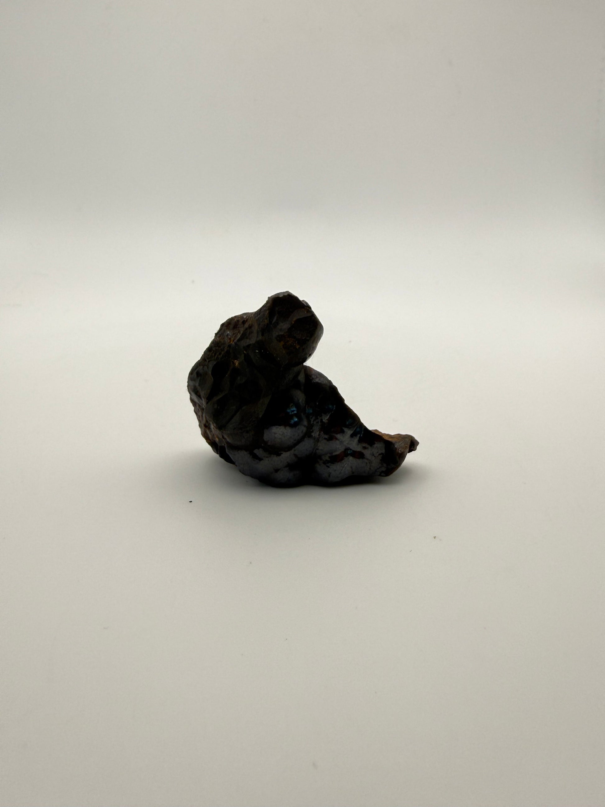 Small raw hematite specimen.