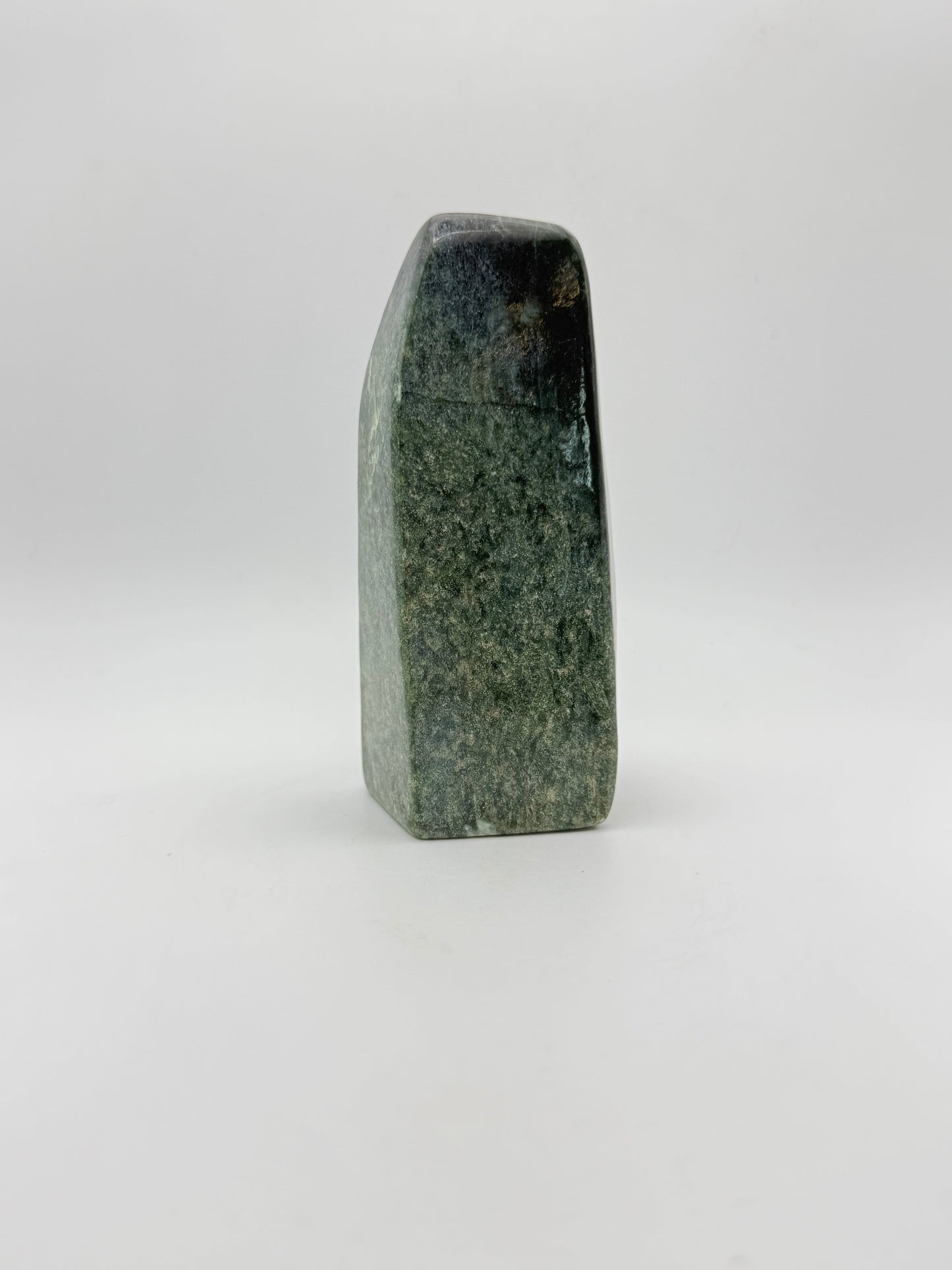 Polished green jade free form.