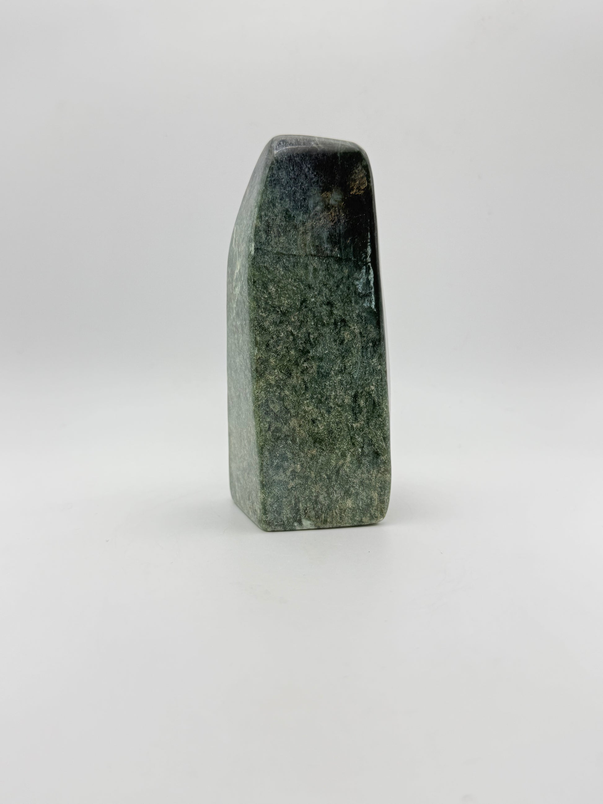 Polished green jade free form.