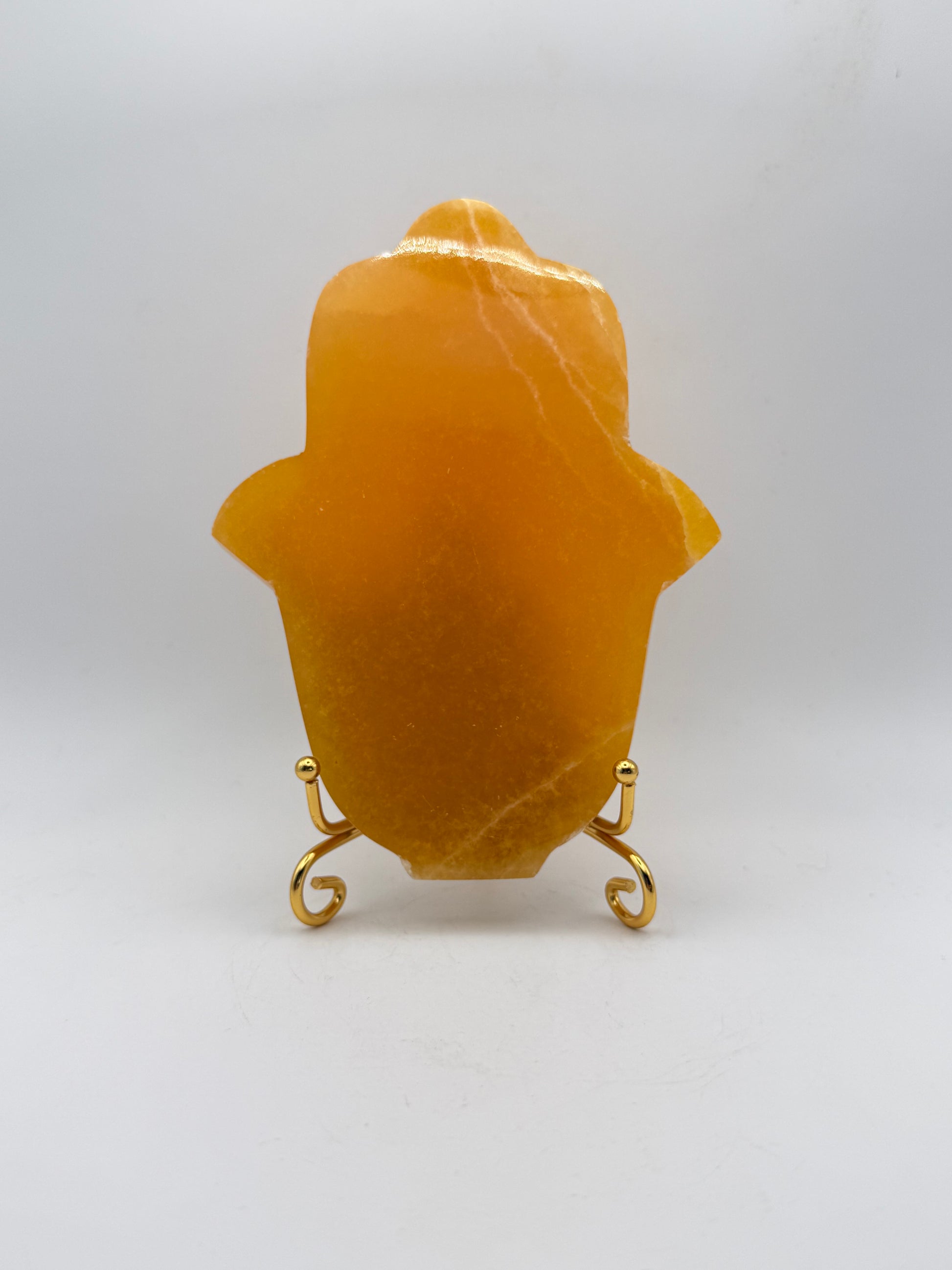 Polished Orange calcite hasma carving.