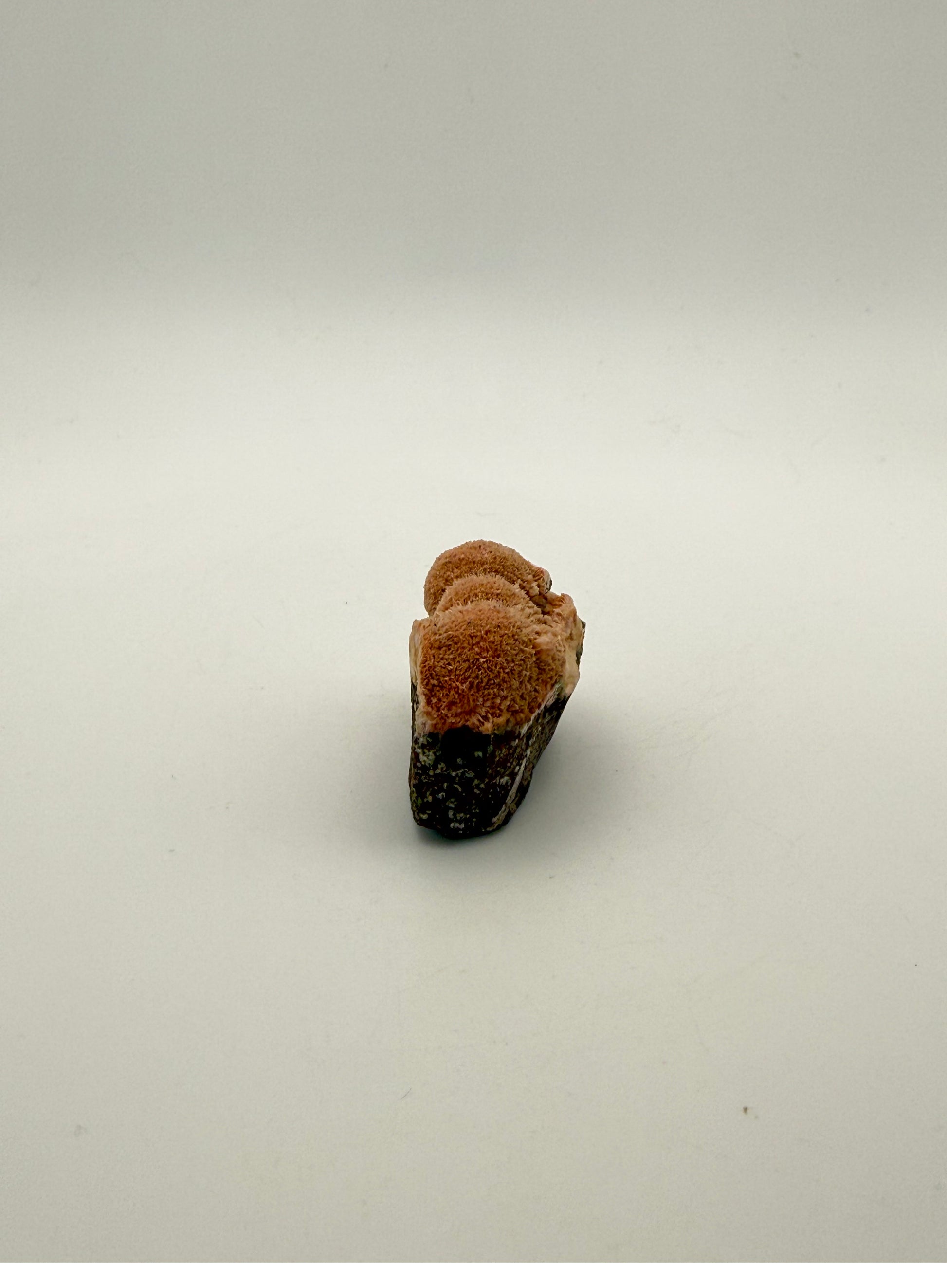 Raw Messolite crystal.