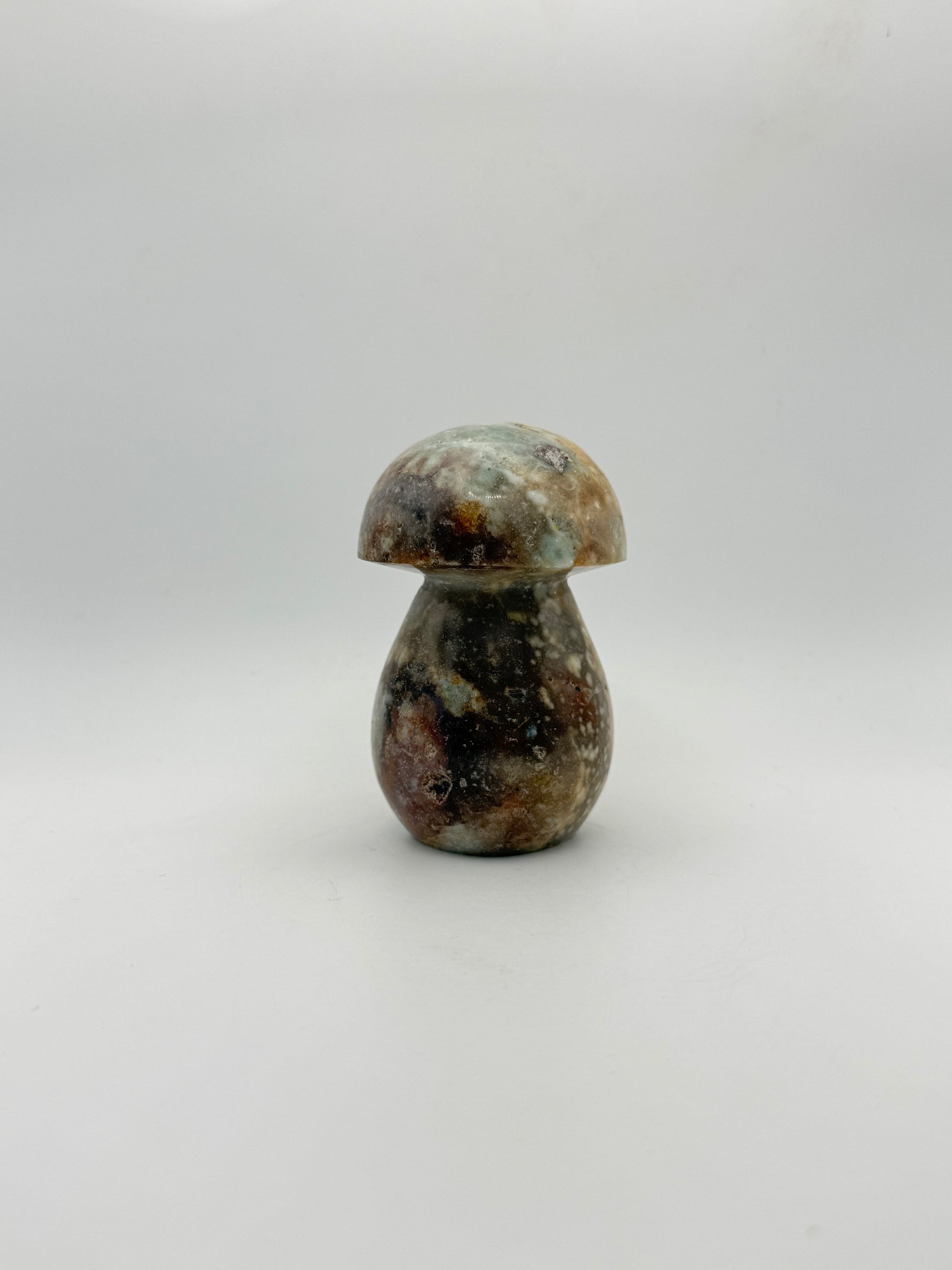 Ocean jasper stone in the shape of a mushroom.