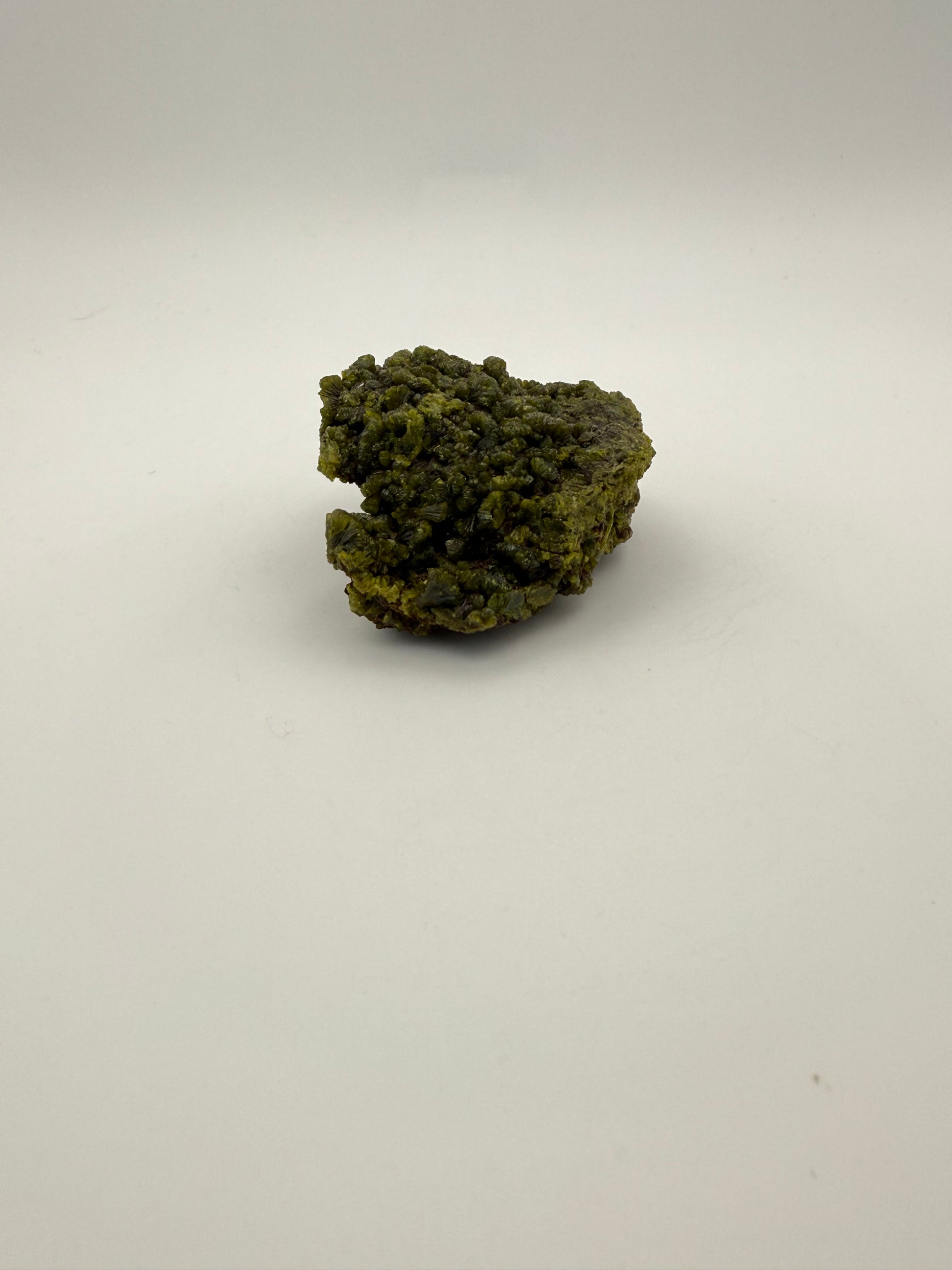 Epidote crystal cluster with good green color.