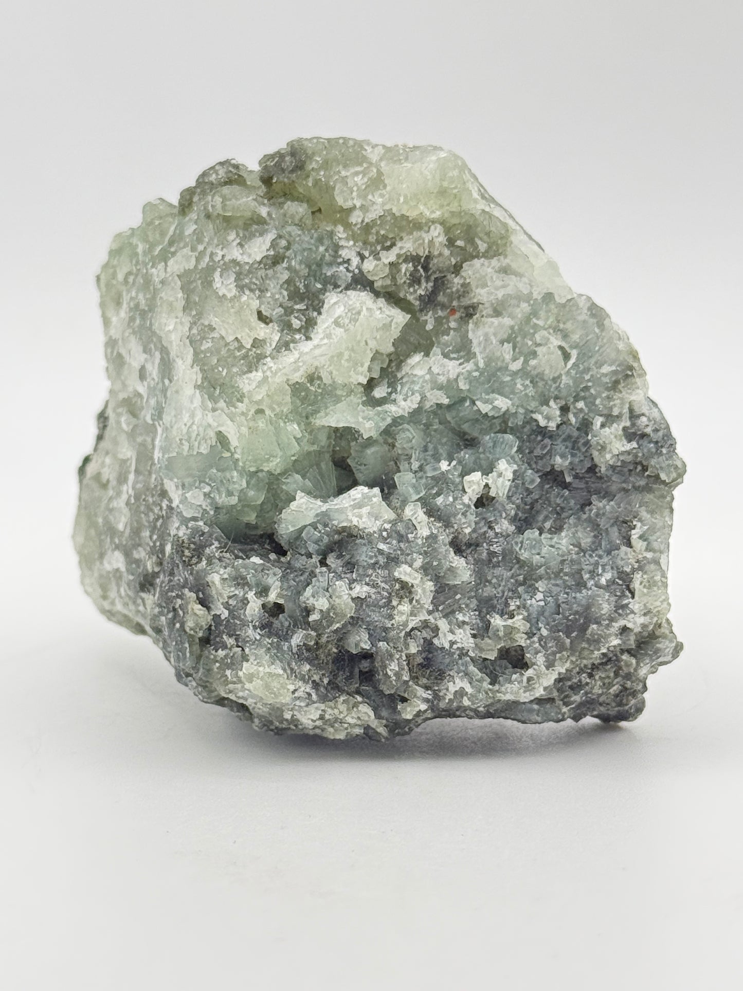 Raw Prehnite specimen with amazing green color.
