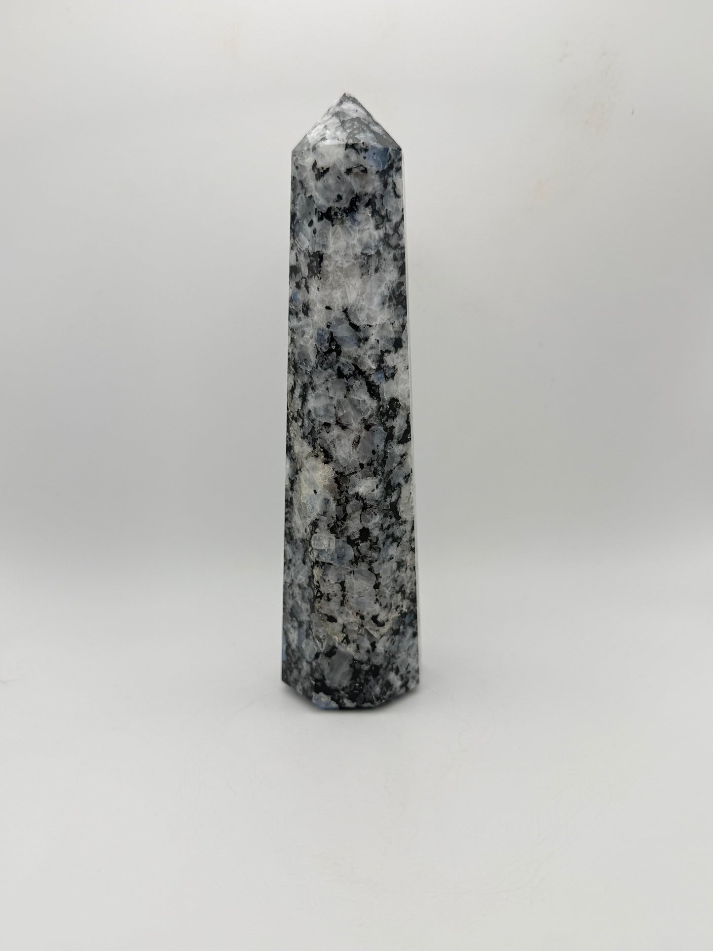 Rainbow moonstone polished tower with nice flashes of blue.