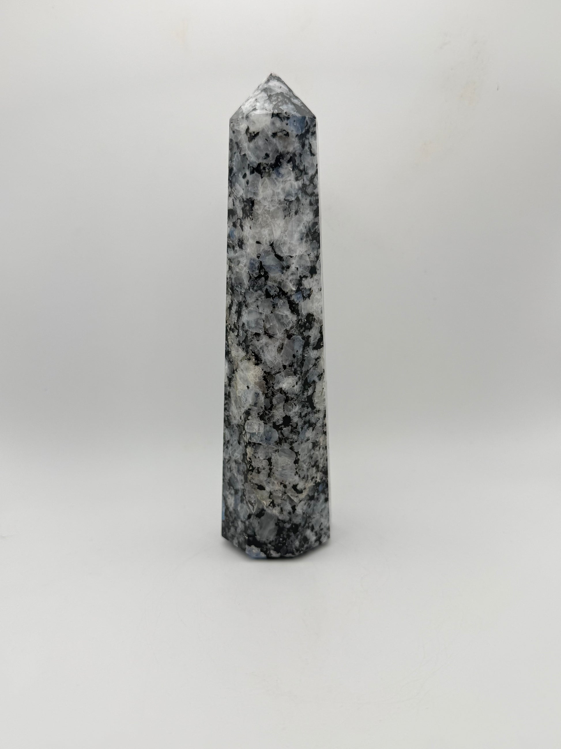 Rainbow moonstone polished tower with nice flashes of blue.