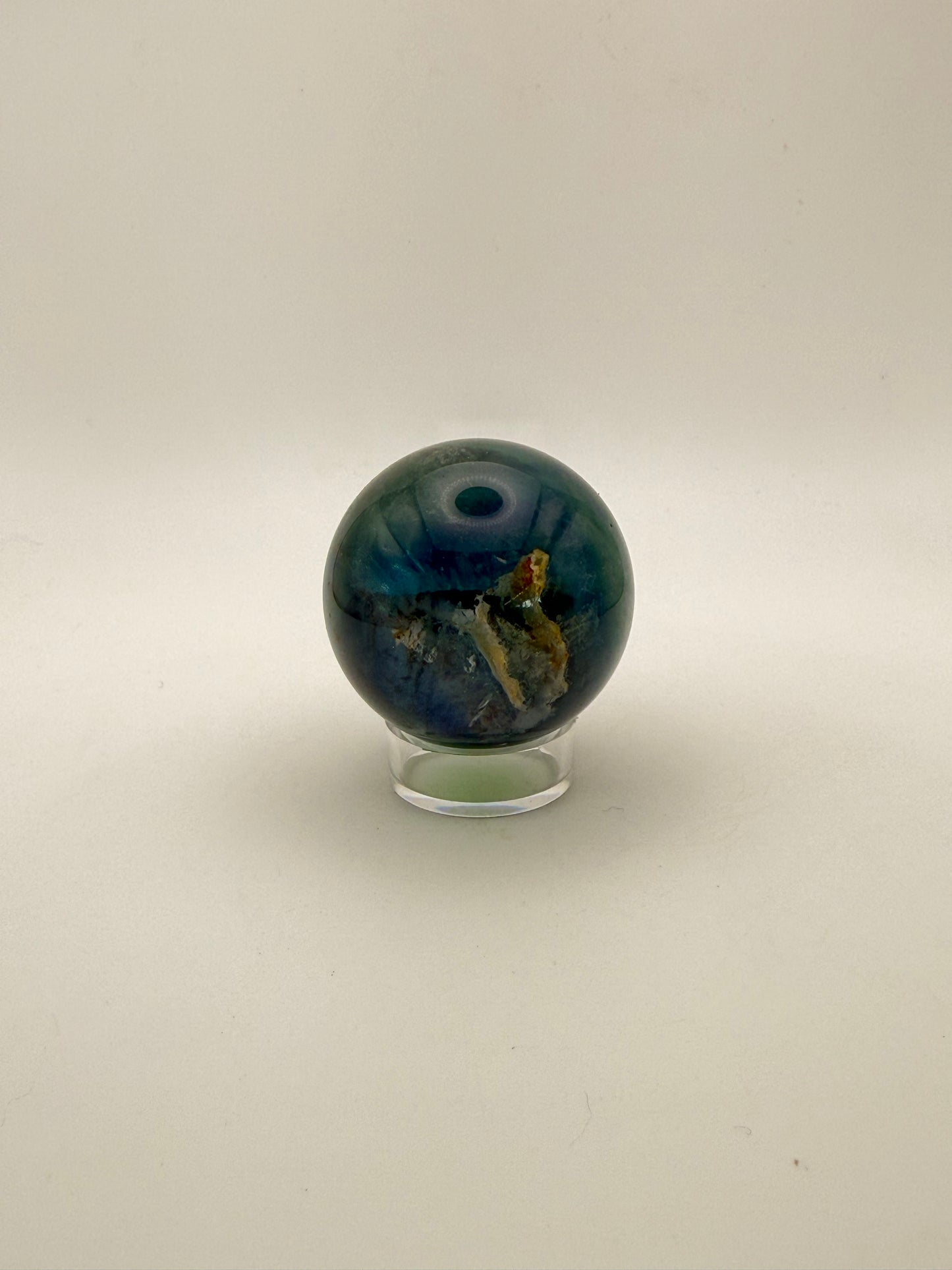 Rainbow Fluorite polished crystal sphere.