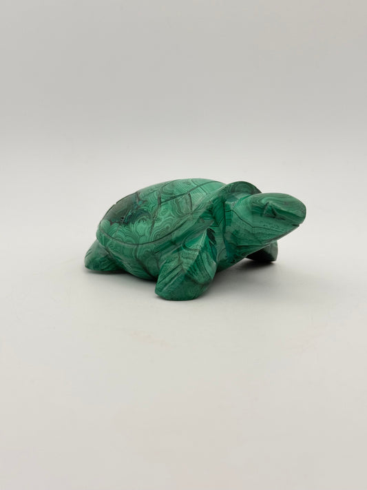 Vibrant green malachite stone carving of a turtle.