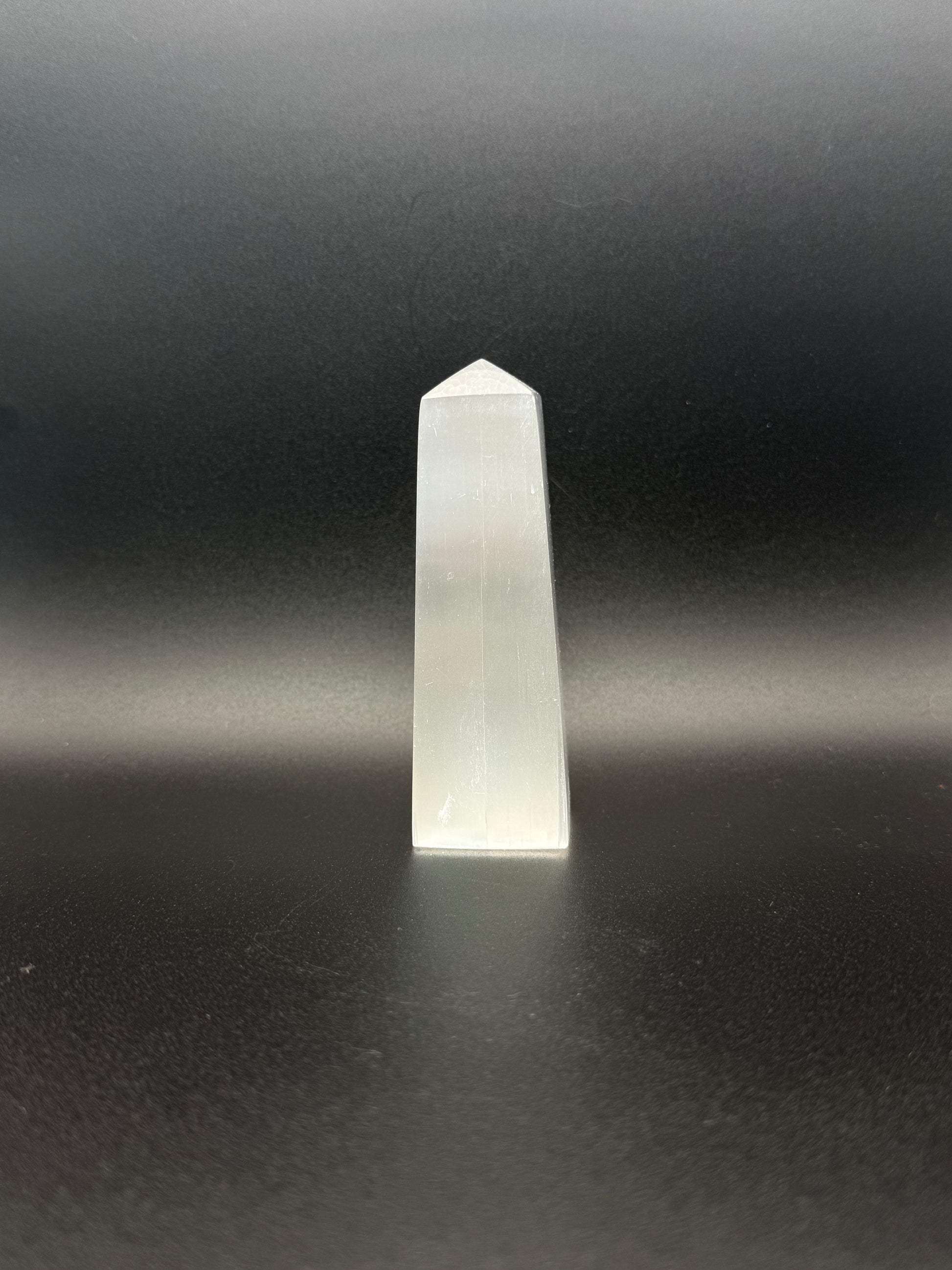 Selenite tower with engraved image of a fairy and stars.