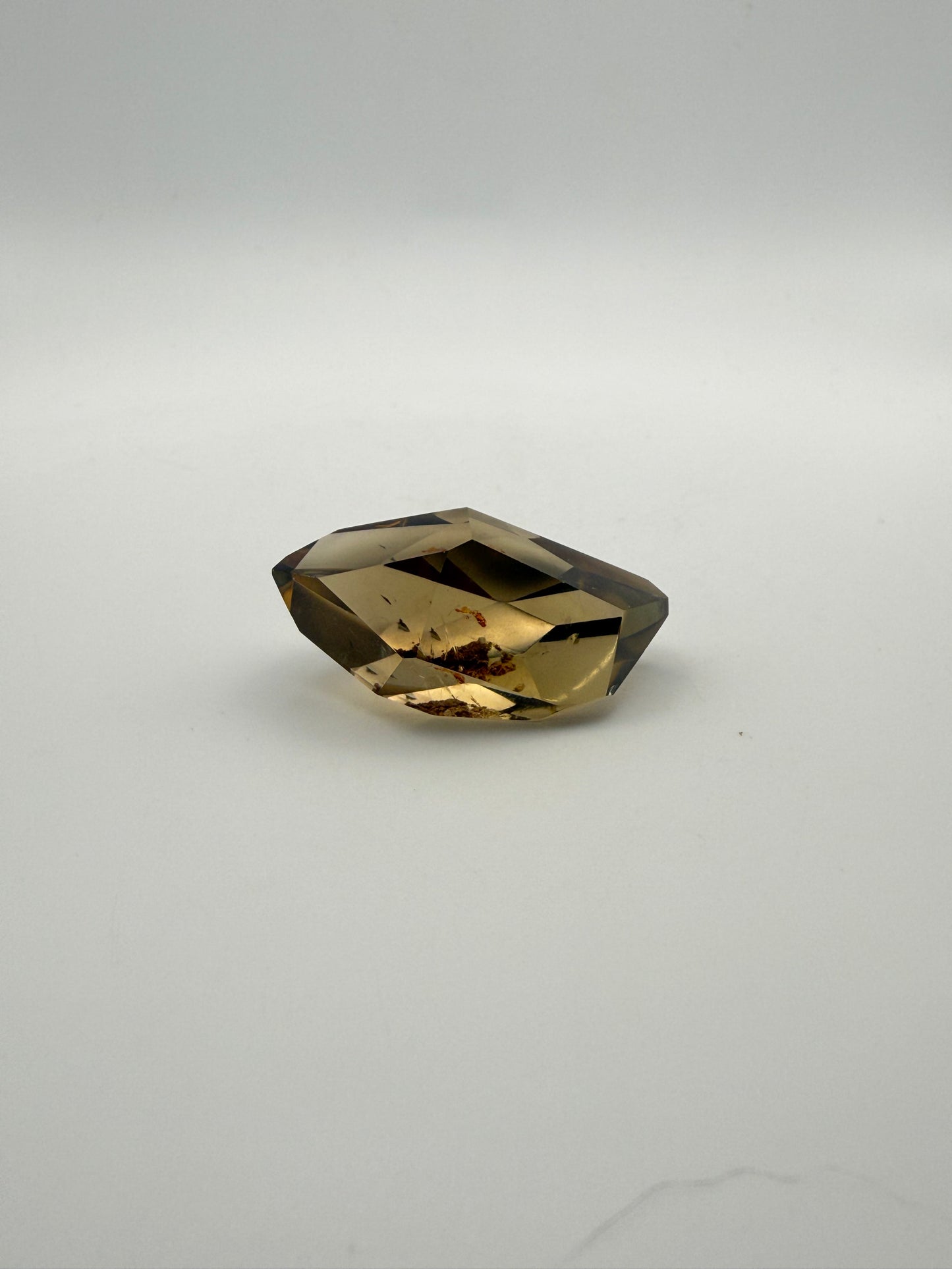 Polished natural citrine point.