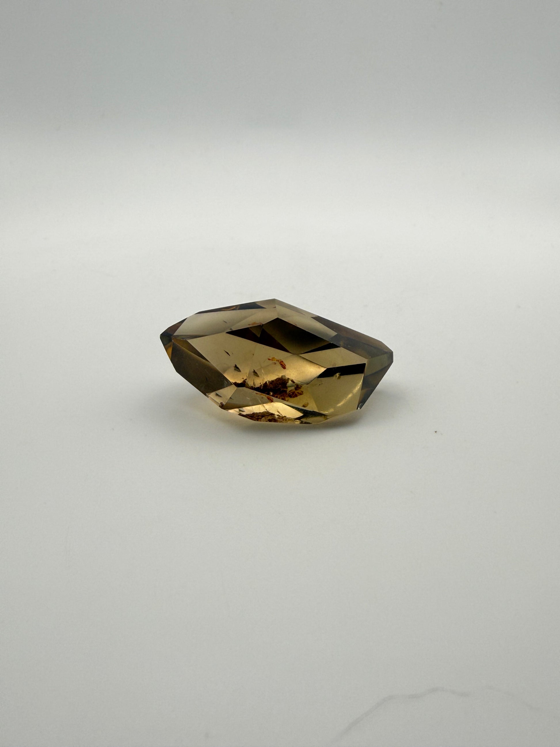 Polished natural citrine point.