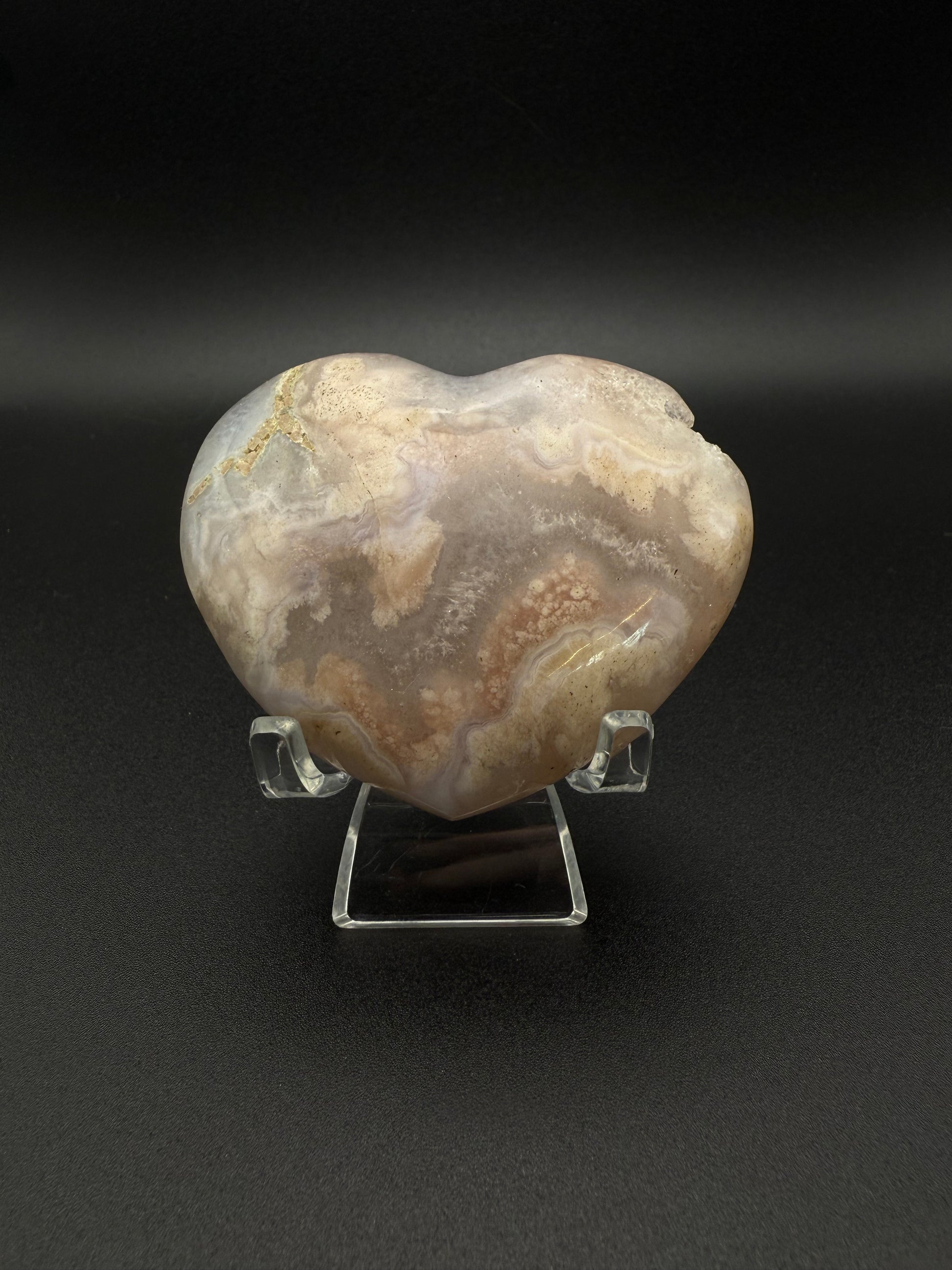Heart-shaped polished flower agate crystal.