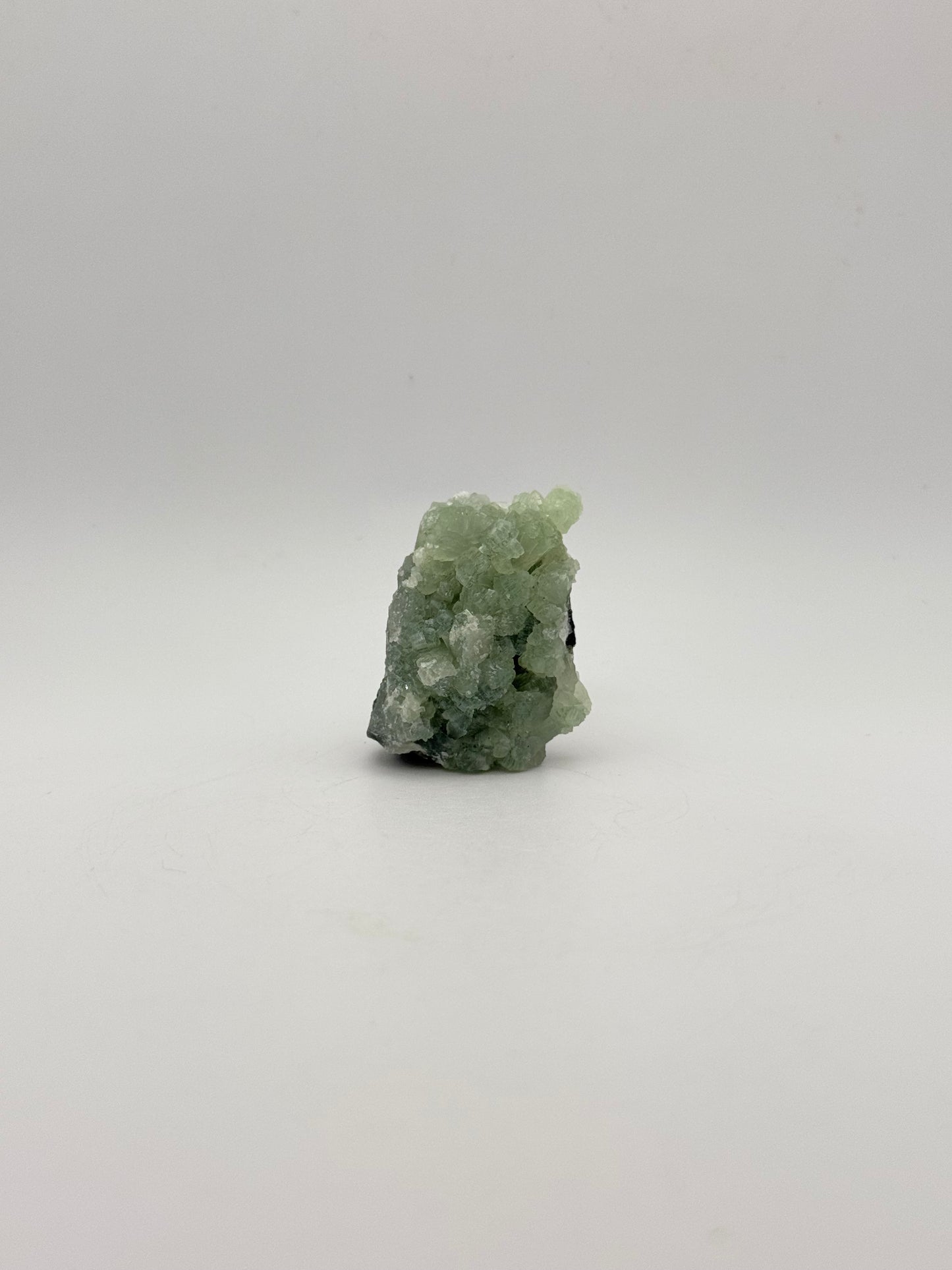 Raw Prehnite specimen with amazing green color.