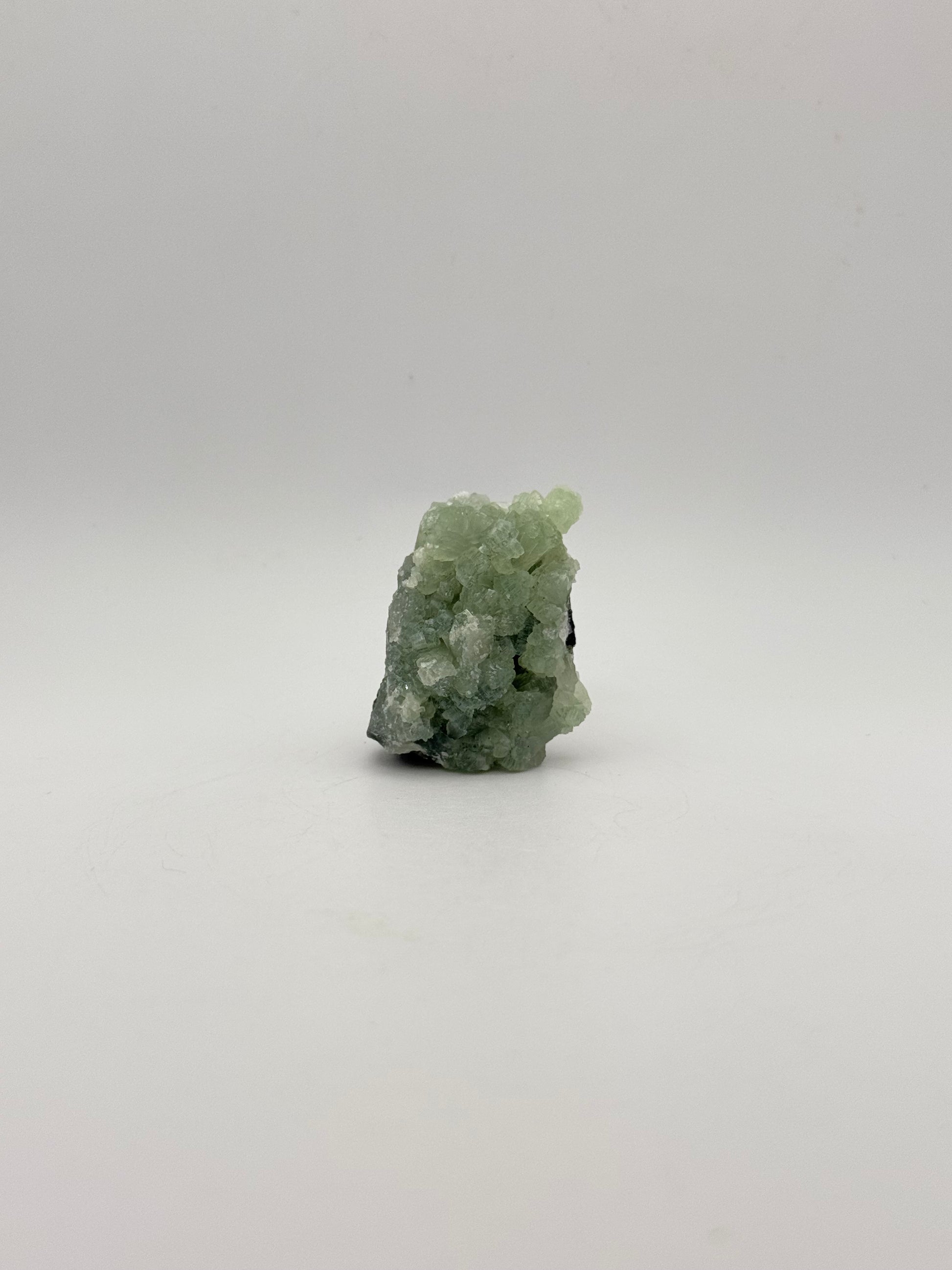 Raw Prehnite specimen with amazing green color.