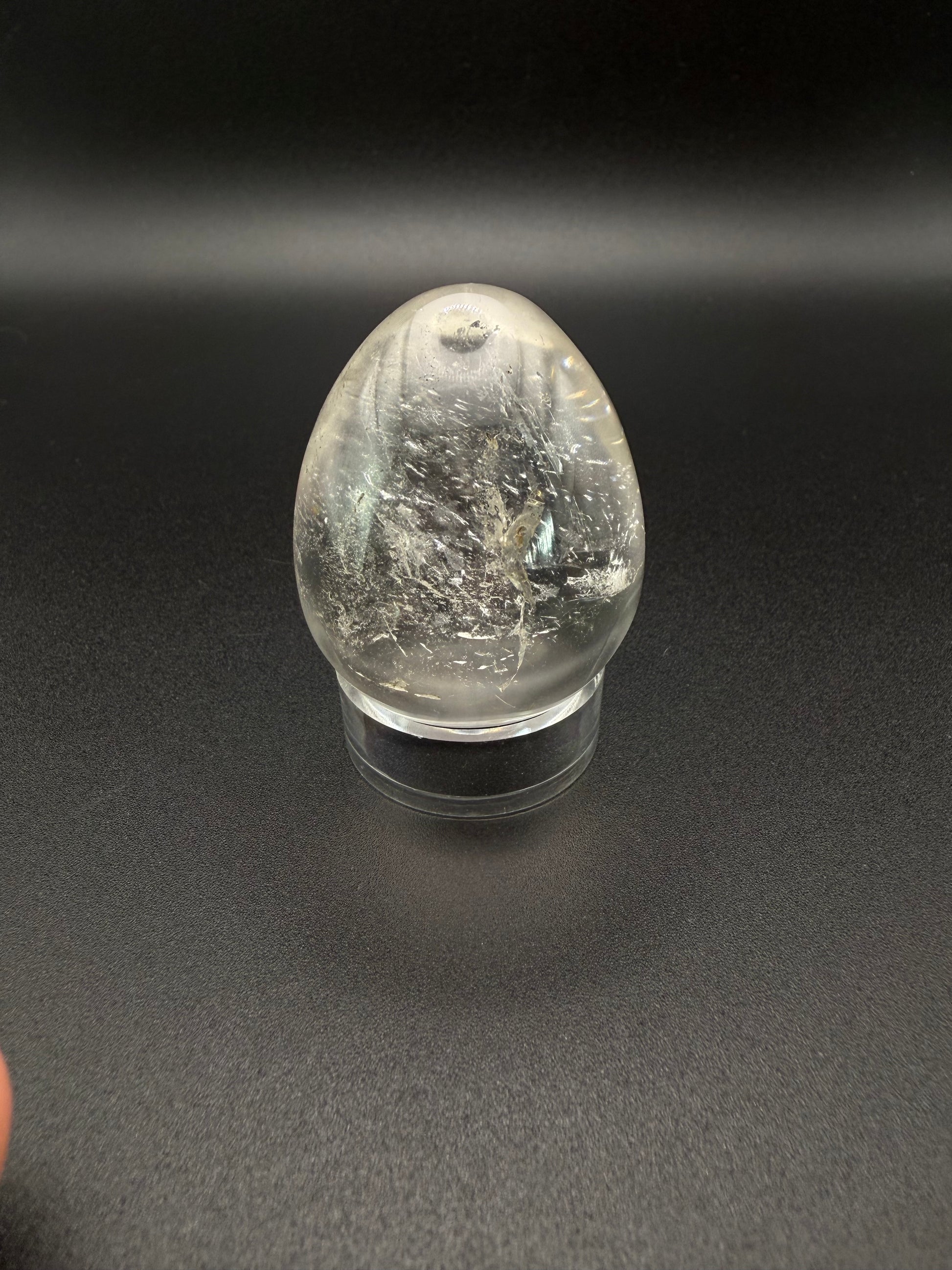 Clear quartz polished crystal in an egg shape.