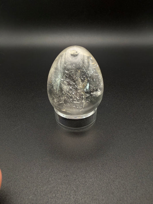 Clear quartz polished crystal in an egg shape.