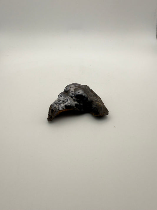 Small raw hematite specimen.