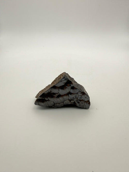 Small raw hematite specimen.
