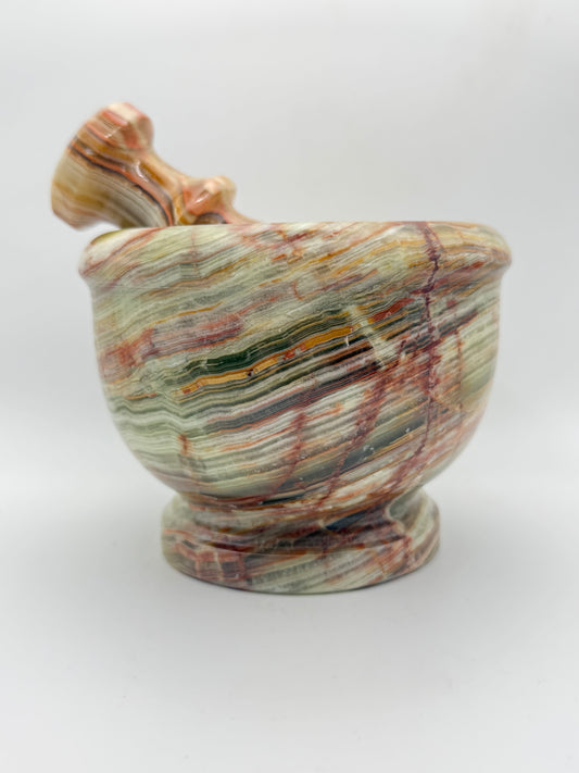 Mortar and pestle made out of onyx stone.
