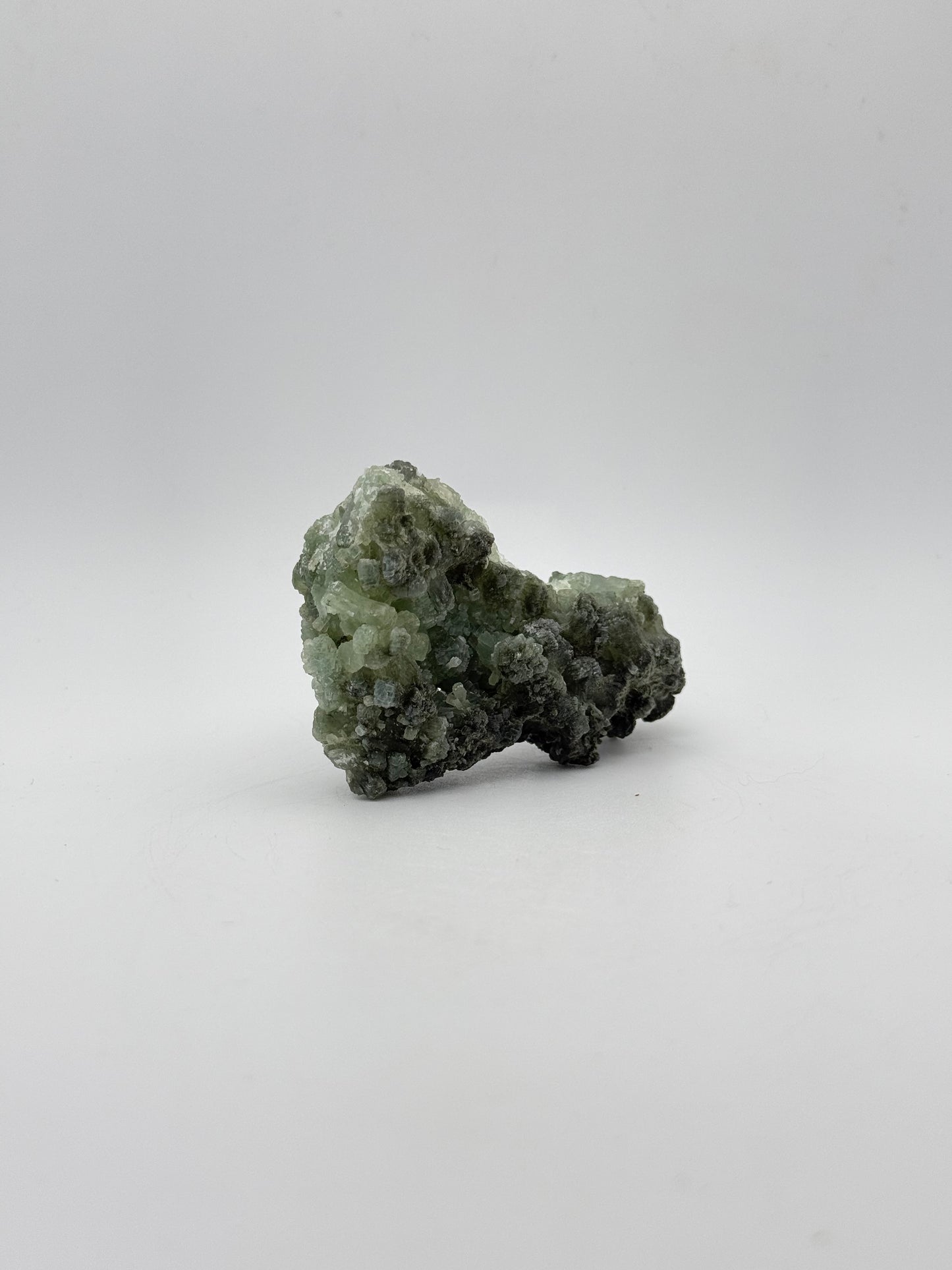 Raw Prehnite specimen with amazing green color.