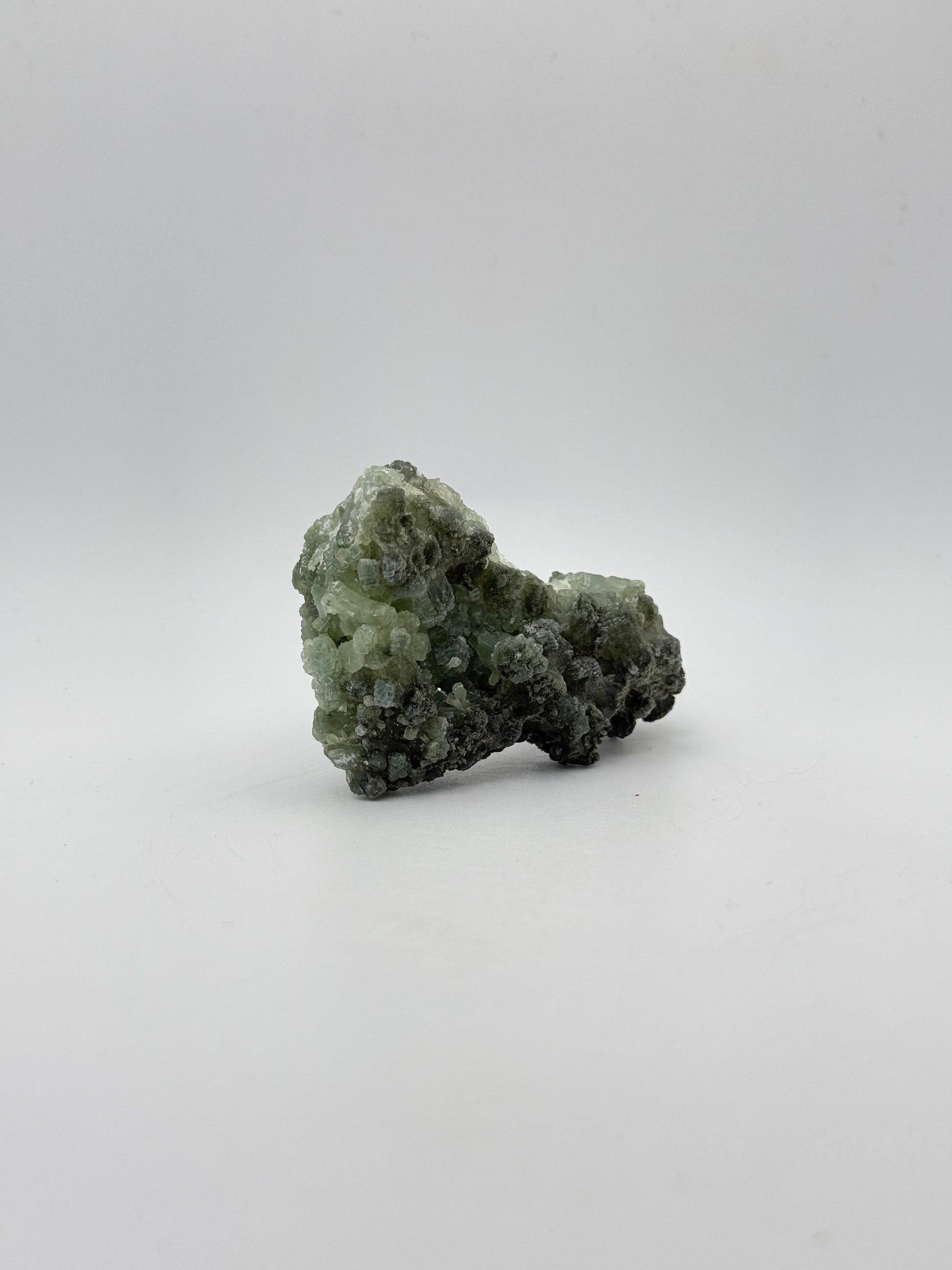 Raw Prehnite specimen with amazing green color.