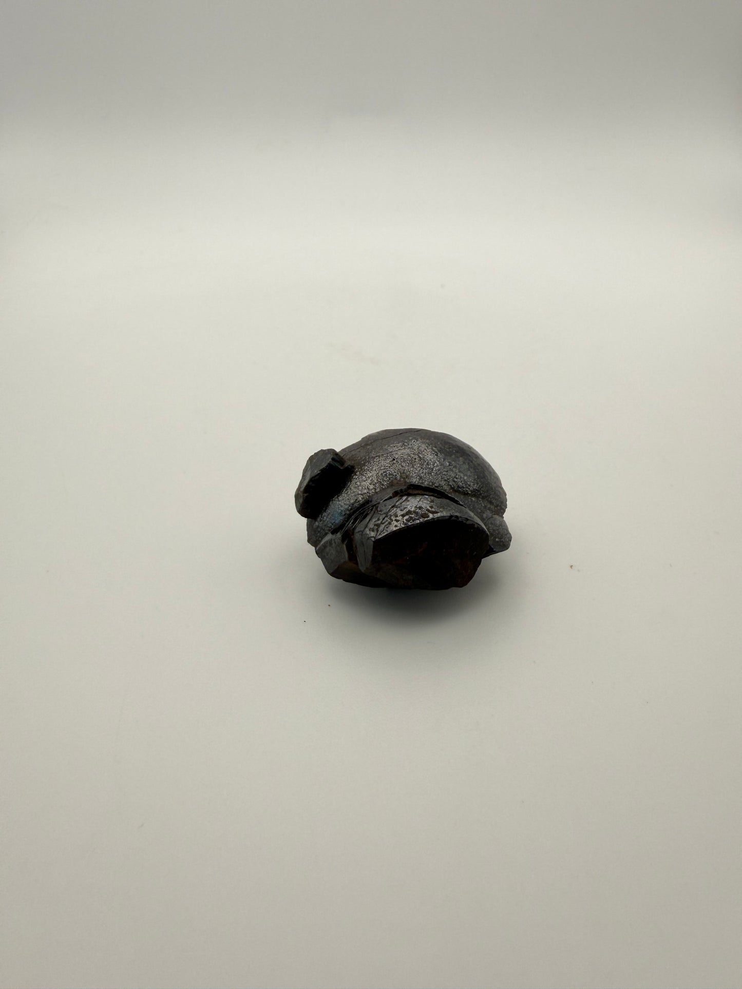 Small raw hematite specimen.