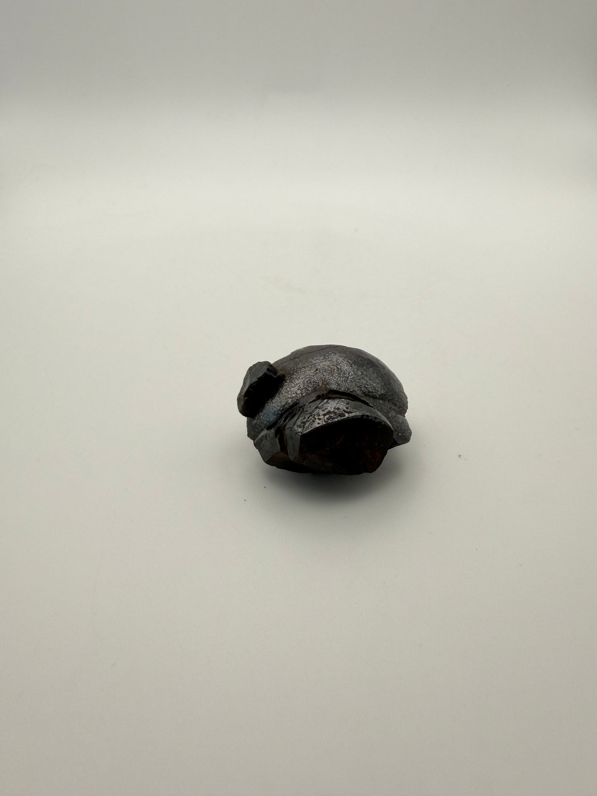 Small raw hematite specimen.