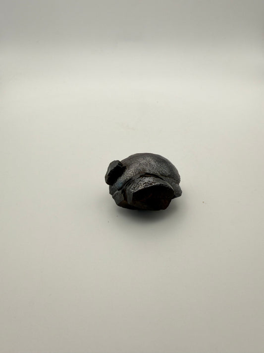 Small raw hematite specimen.