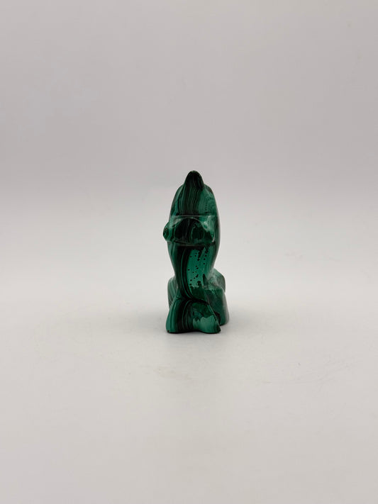 Polished malachite dolphin carving.