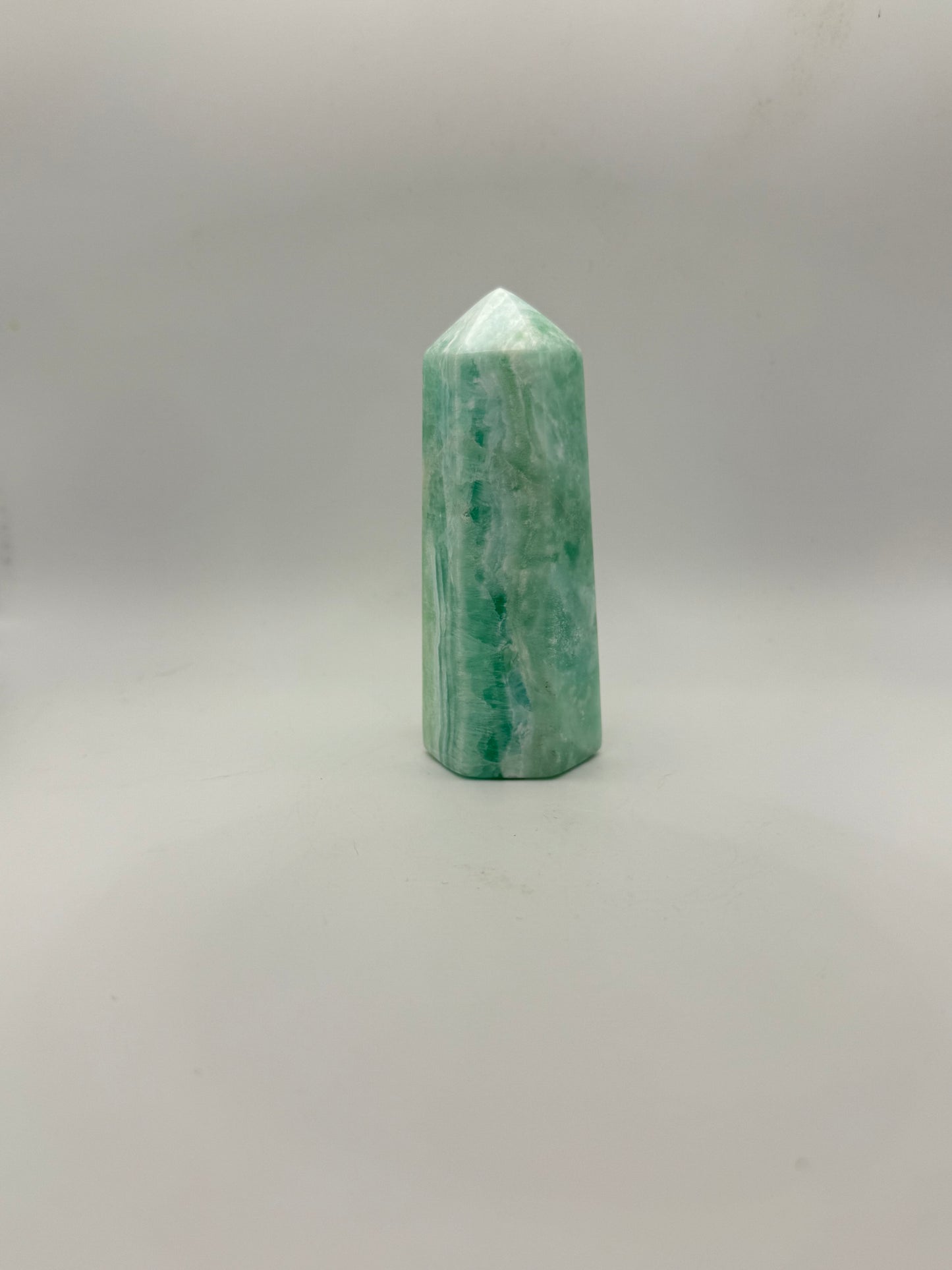 Caribbean Calcite polished six sided tower. A little over 4 inches tall.