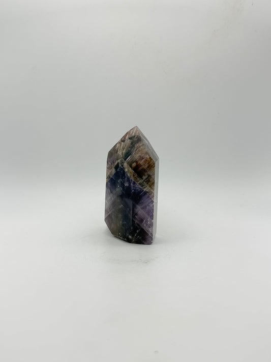 Polished super 7 in the shape of a tower.