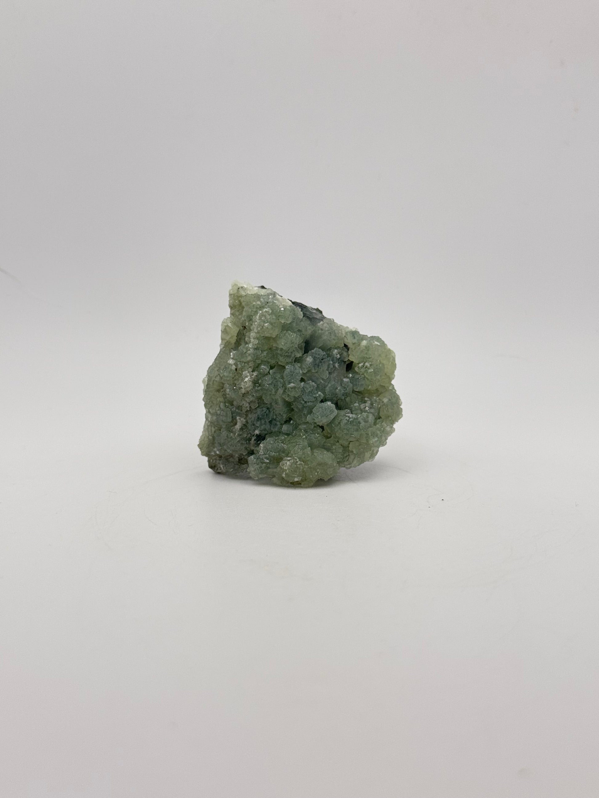 Raw Prehnite specimen with amazing green color.